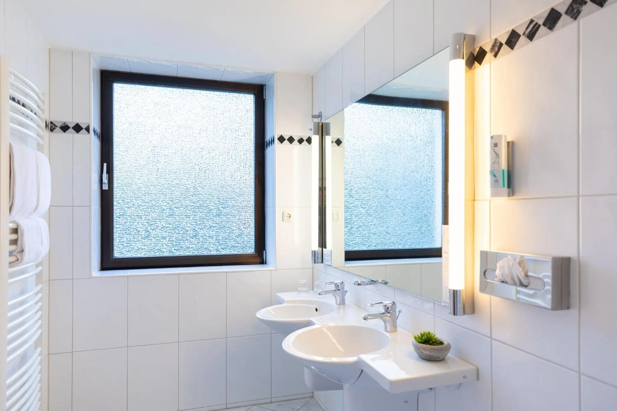 Bathroom in Garner Hotel Cologne East by IHG