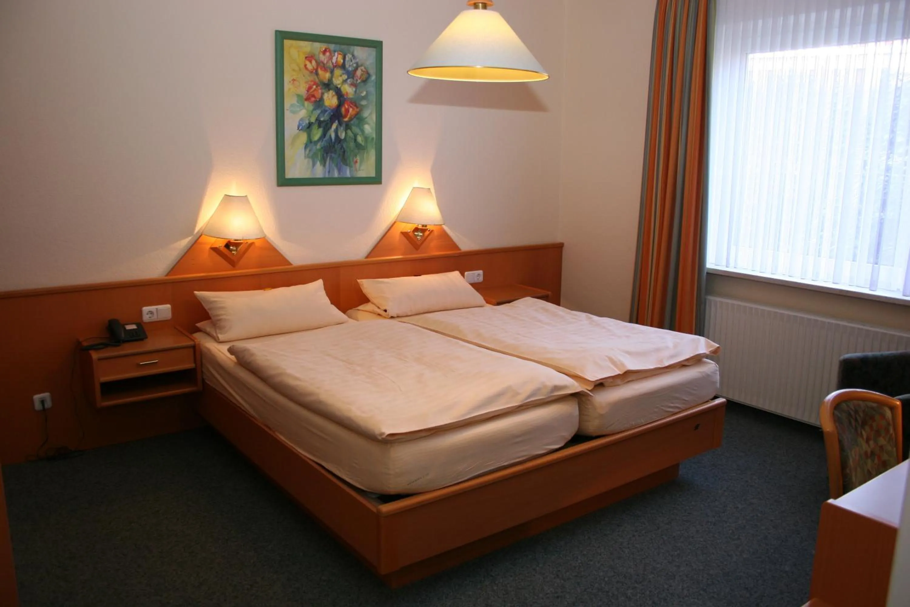 Bed in Hotel Petersen