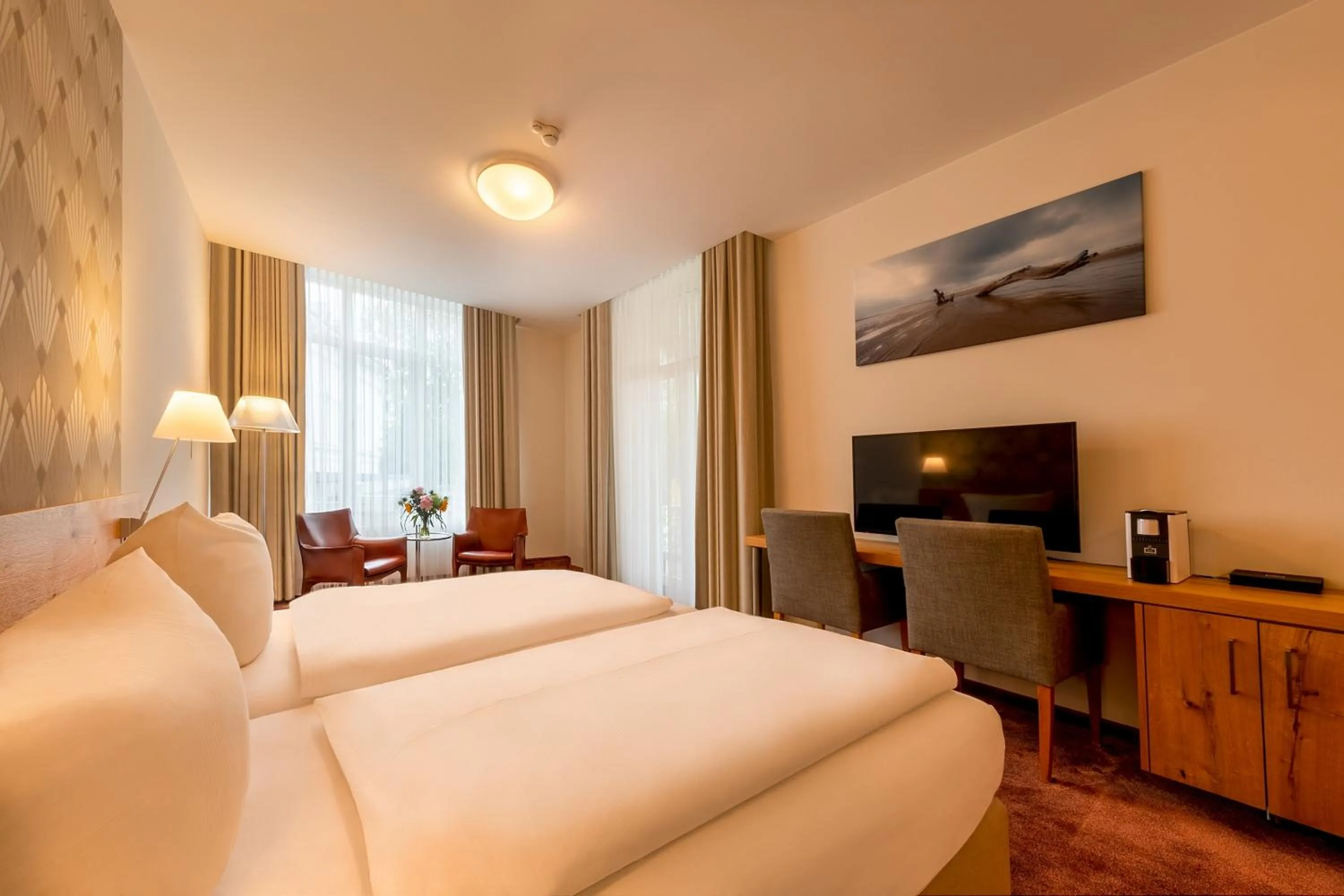 Photo of the whole room, Bed in Michels Thalasso Hotel Nordseehaus