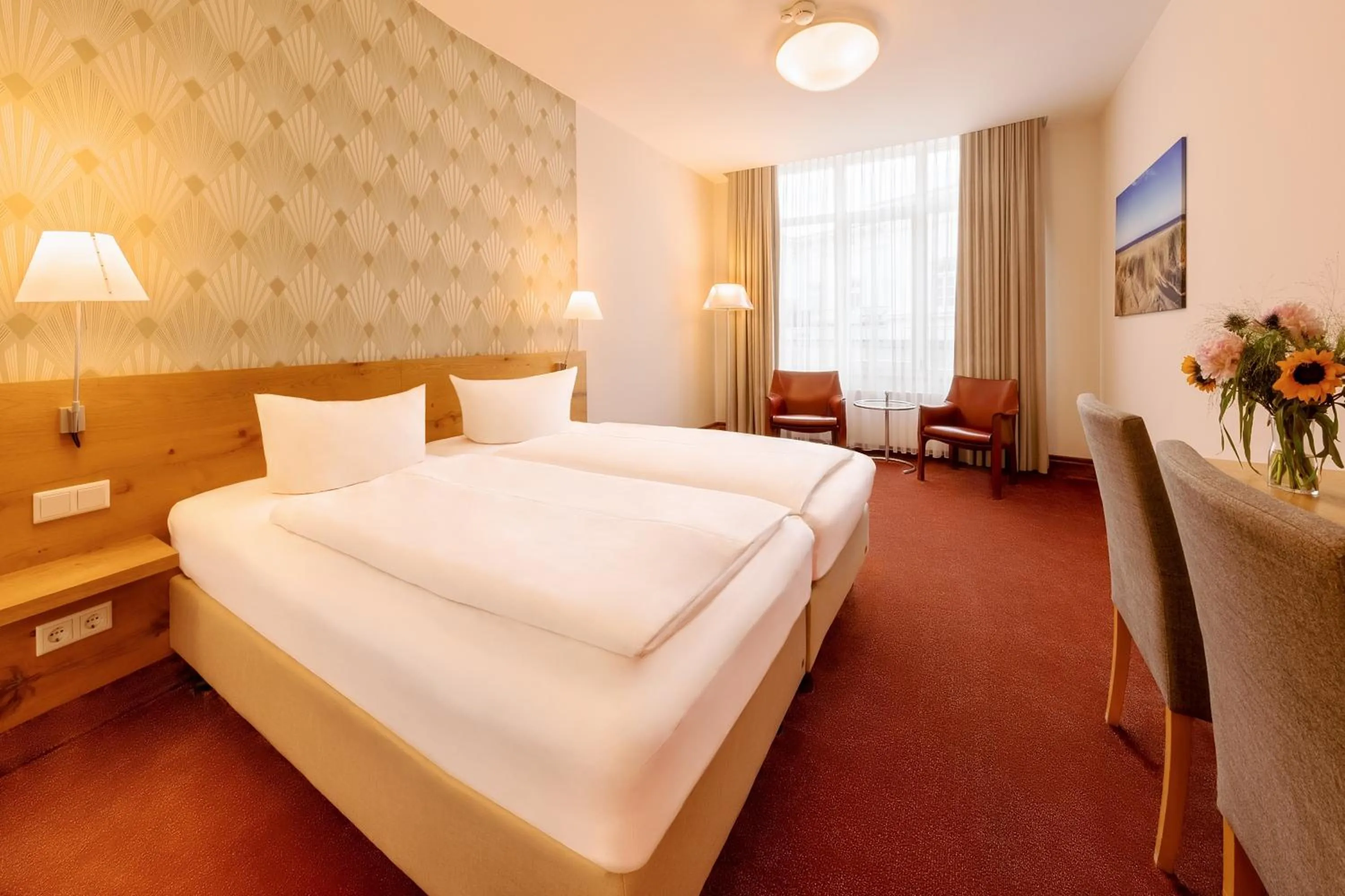 Photo of the whole room, Bed in Michels Thalasso Hotel Nordseehaus