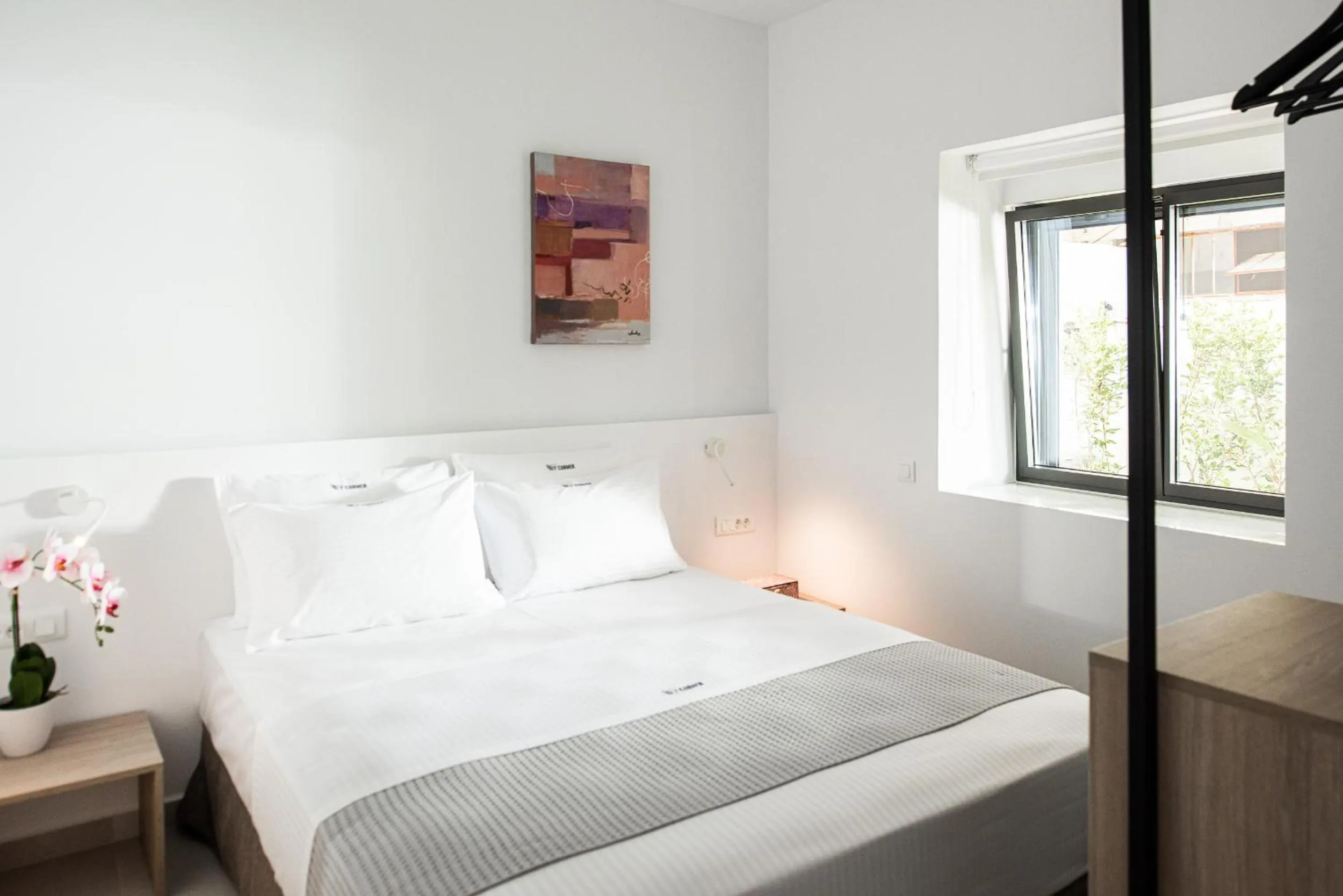 Bed in Cozy Corner Luxury Apartments