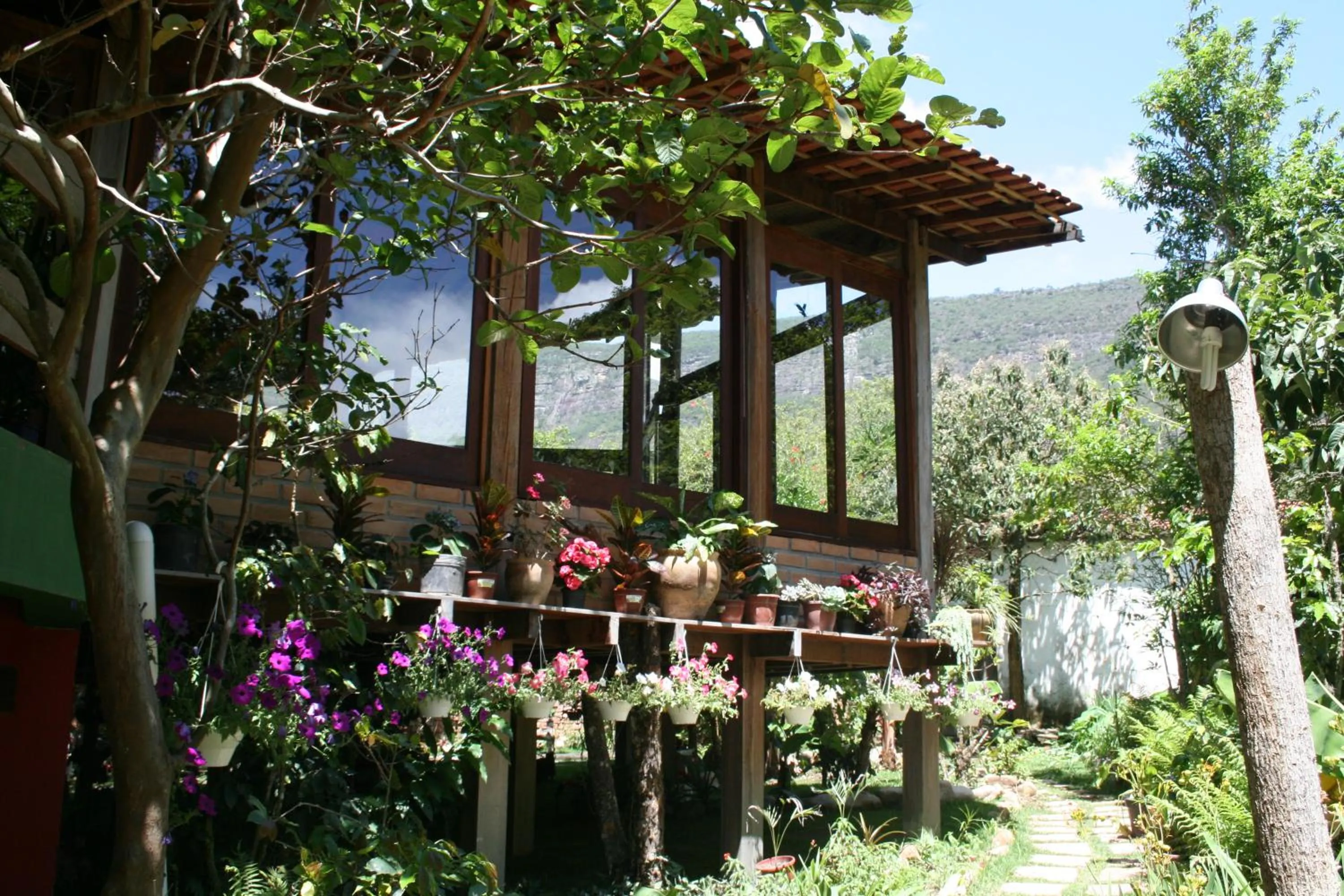 Communal lounge/ TV room in Lendas do Capão Pousada