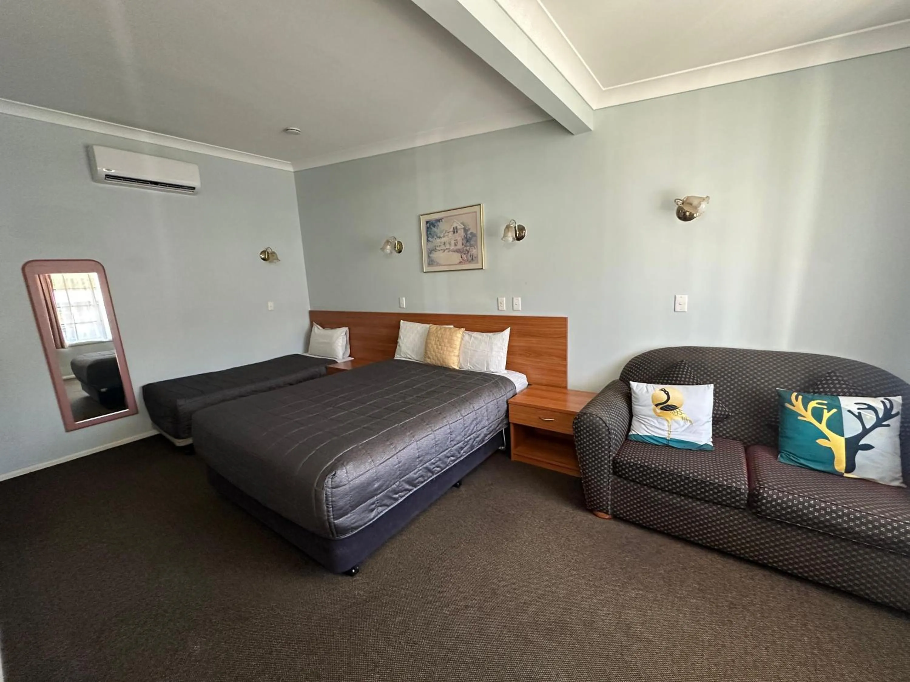 Bed in Colonial Motor Lodge Scone