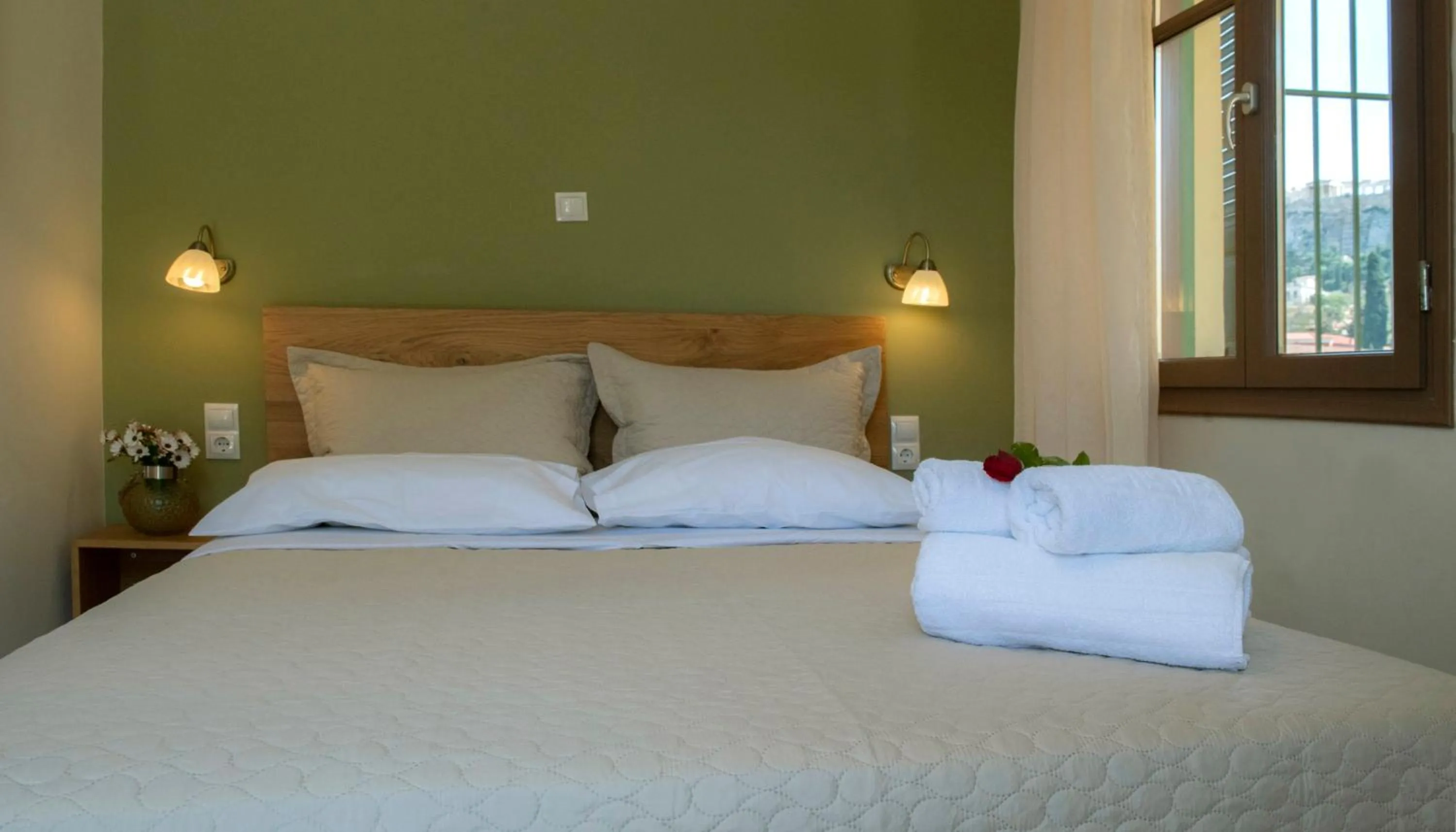 Bed in Beautiful City Suites