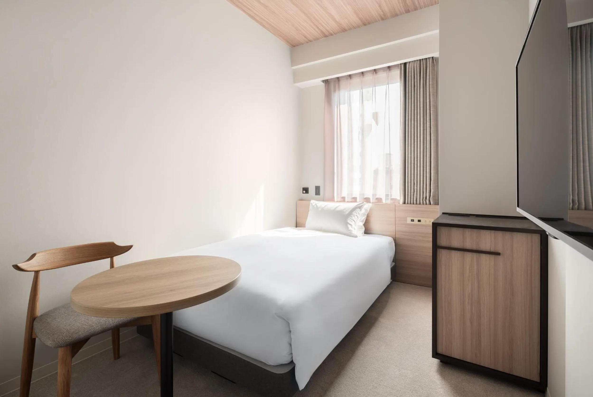 Photo of the whole room, Bed in Nest Hotel Hiroshima Ekimae