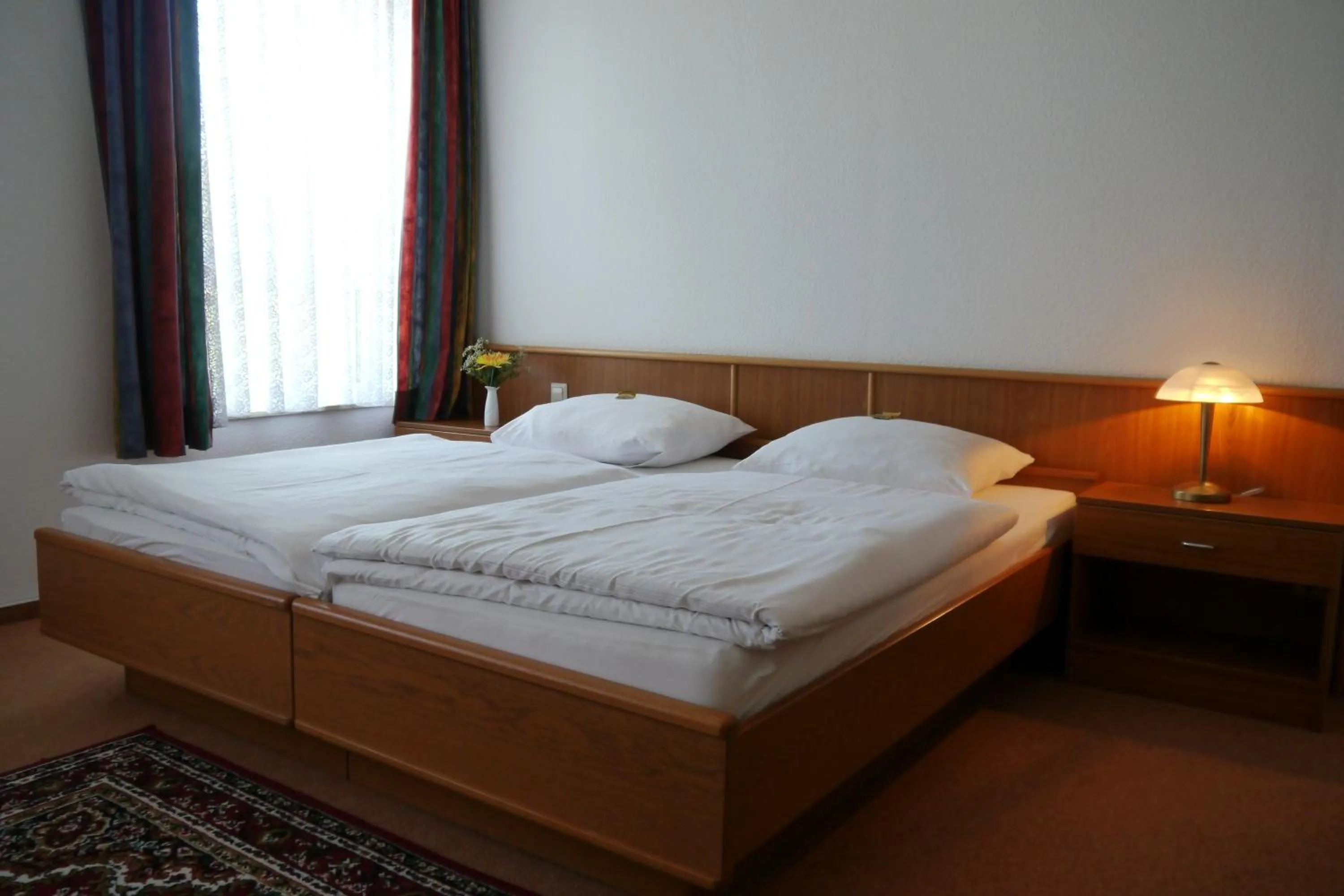 Bed in Erbenholz Hotel