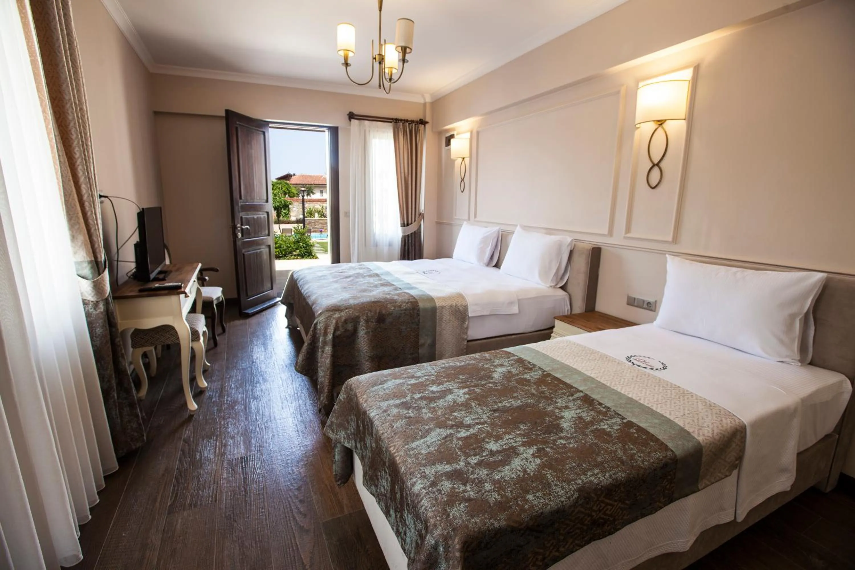 Bed in Livia Garden Hotel