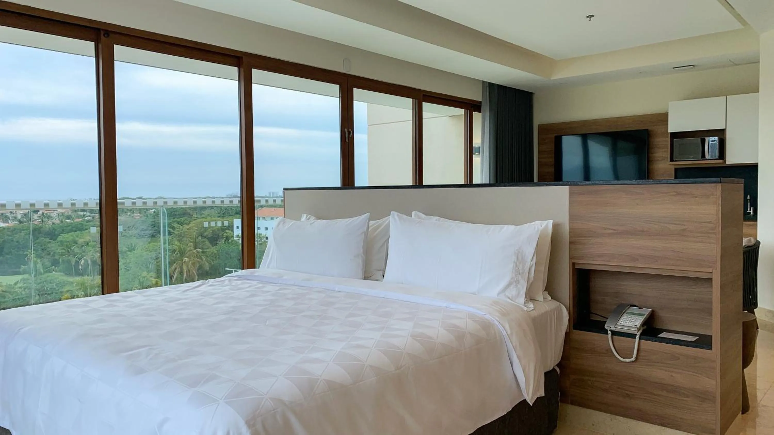 Photo of the whole room, Bed in Holiday Inn & Suites - Puerto Vallarta Marina & Golf by IHG