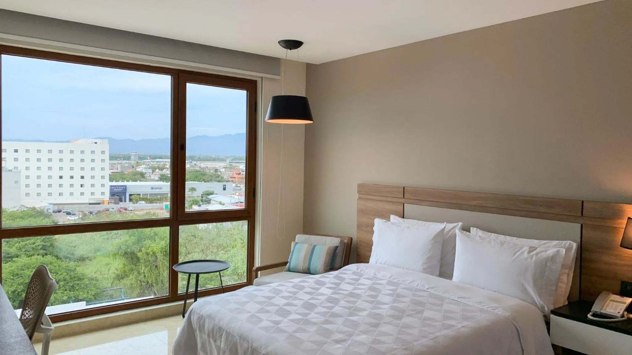 Photo of the whole room, Bed in Holiday Inn & Suites - Puerto Vallarta Marina & Golf by IHG