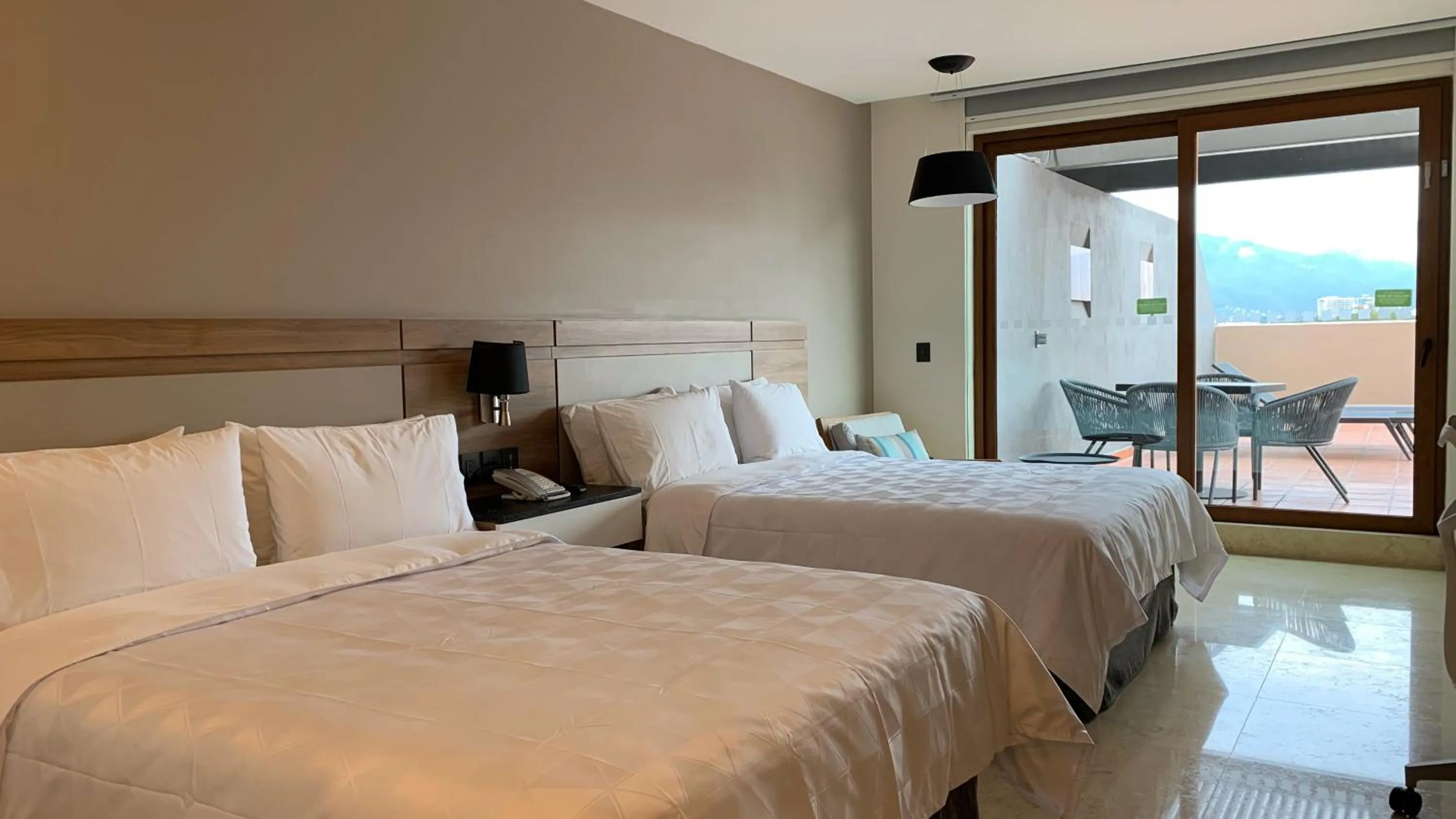 Photo of the whole room, Bed in Holiday Inn & Suites - Puerto Vallarta Marina & Golf by IHG