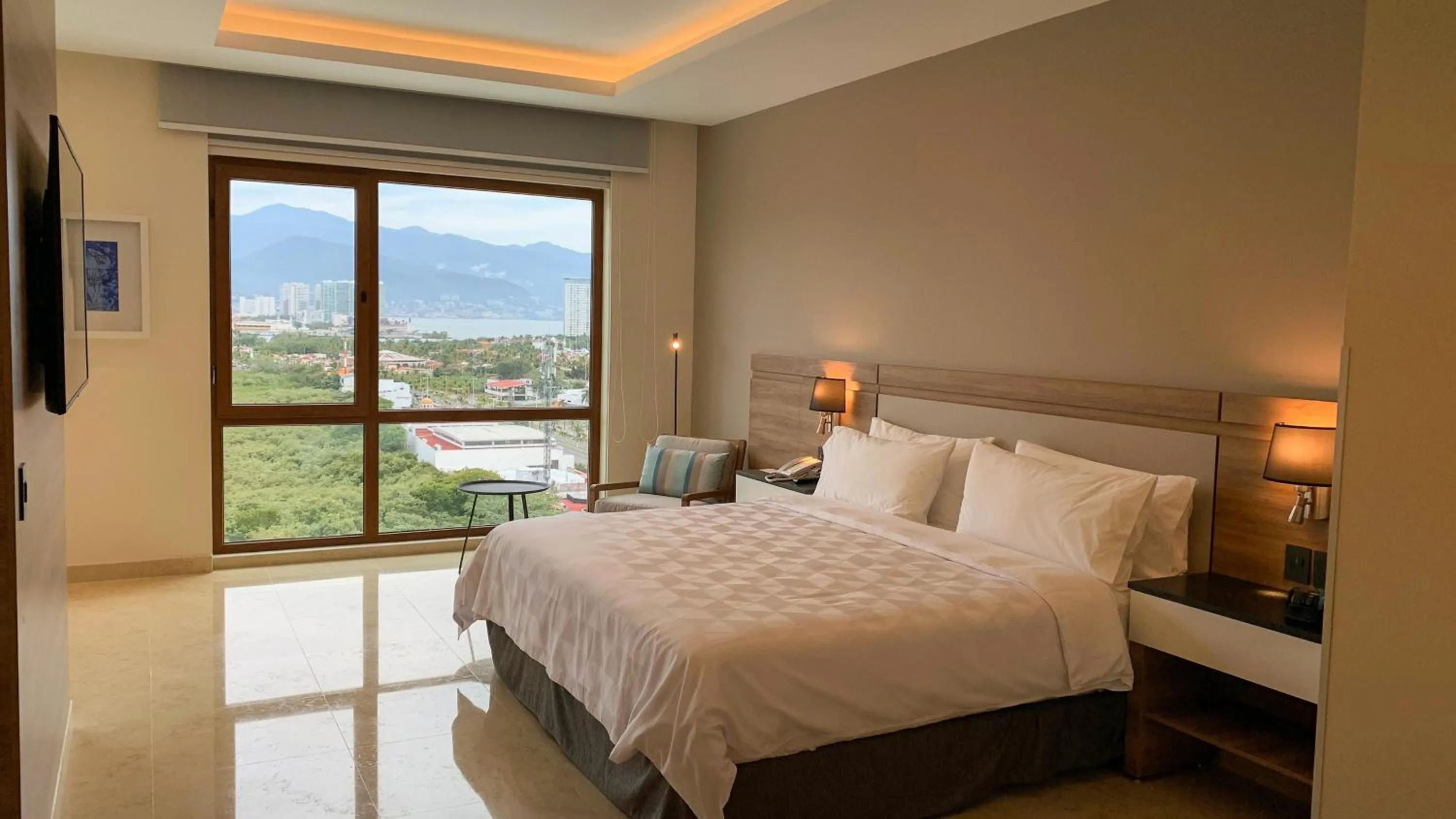 Photo of the whole room, Bed in Holiday Inn & Suites - Puerto Vallarta Marina & Golf by IHG