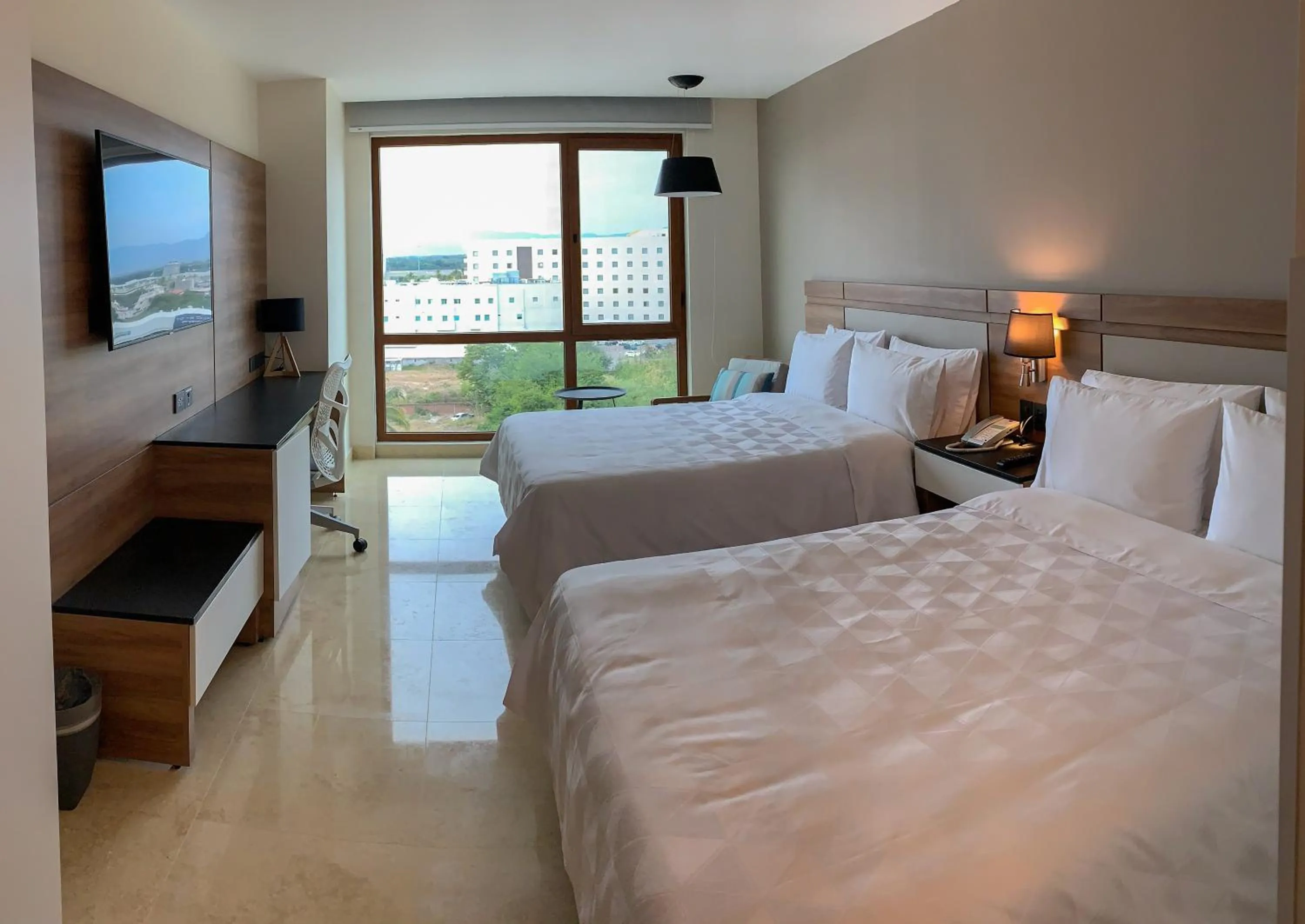 Photo of the whole room, Bed in Holiday Inn & Suites - Puerto Vallarta Marina & Golf by IHG