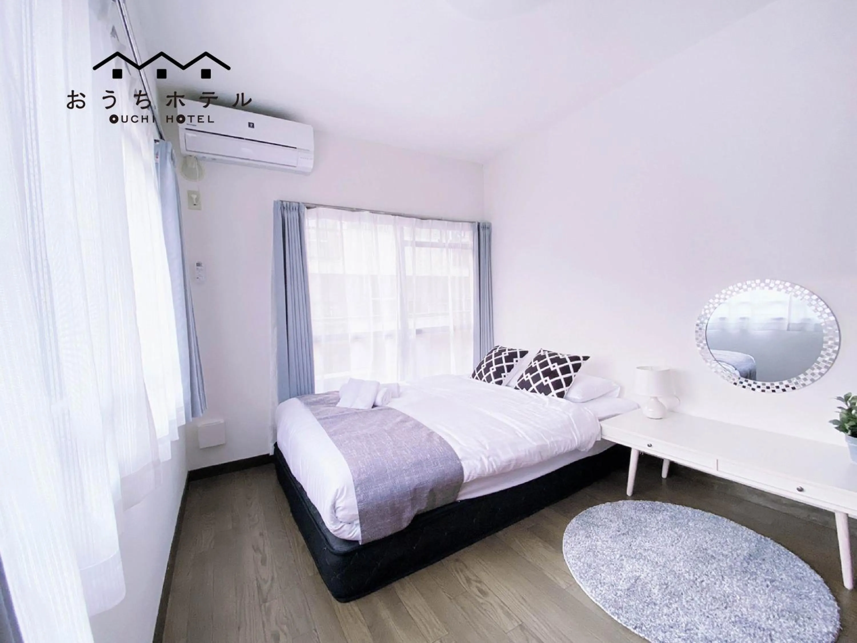 Bed in OUCHI HOTEL Itsukaichi