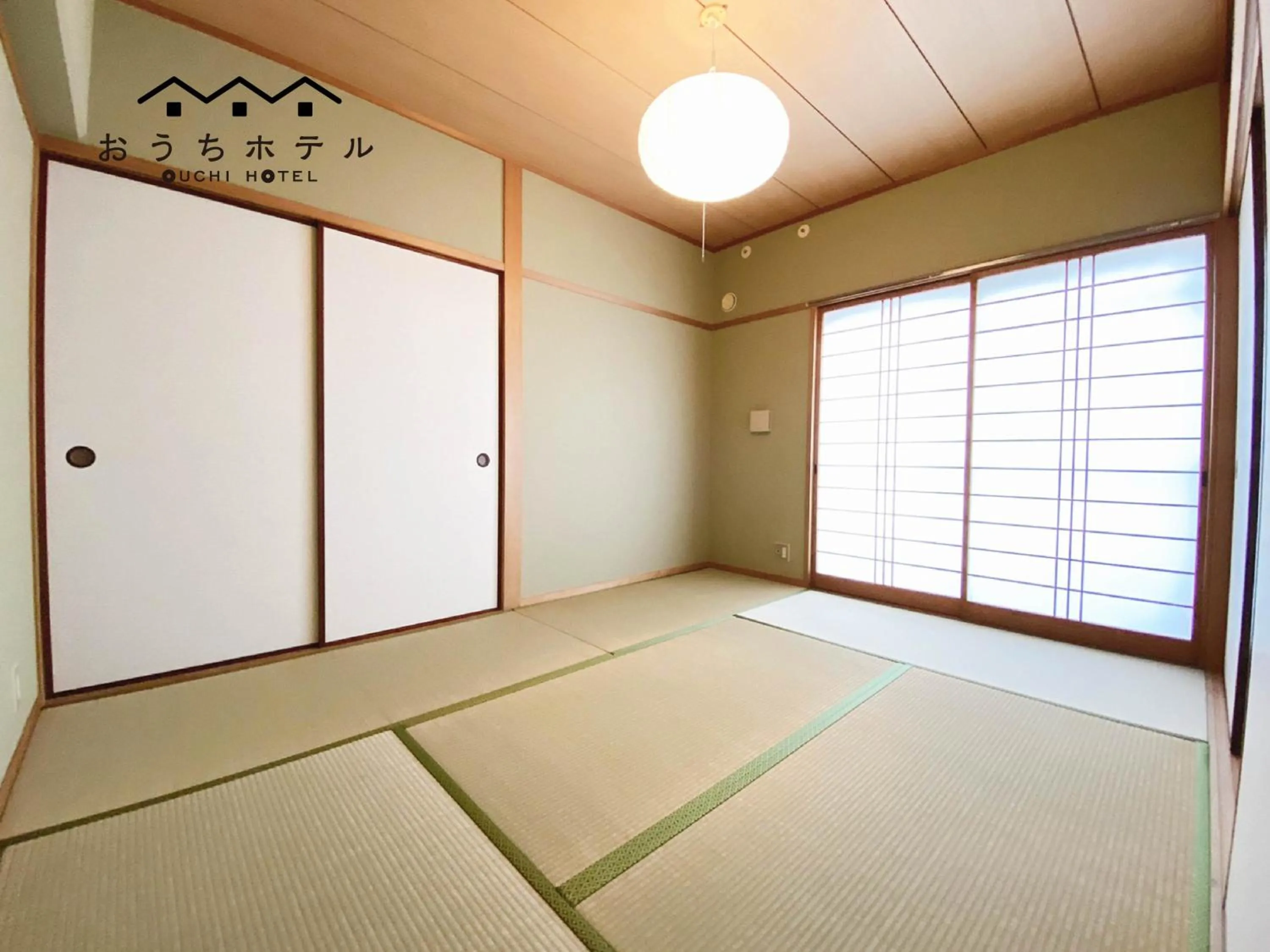 Bed in OUCHI HOTEL Itsukaichi