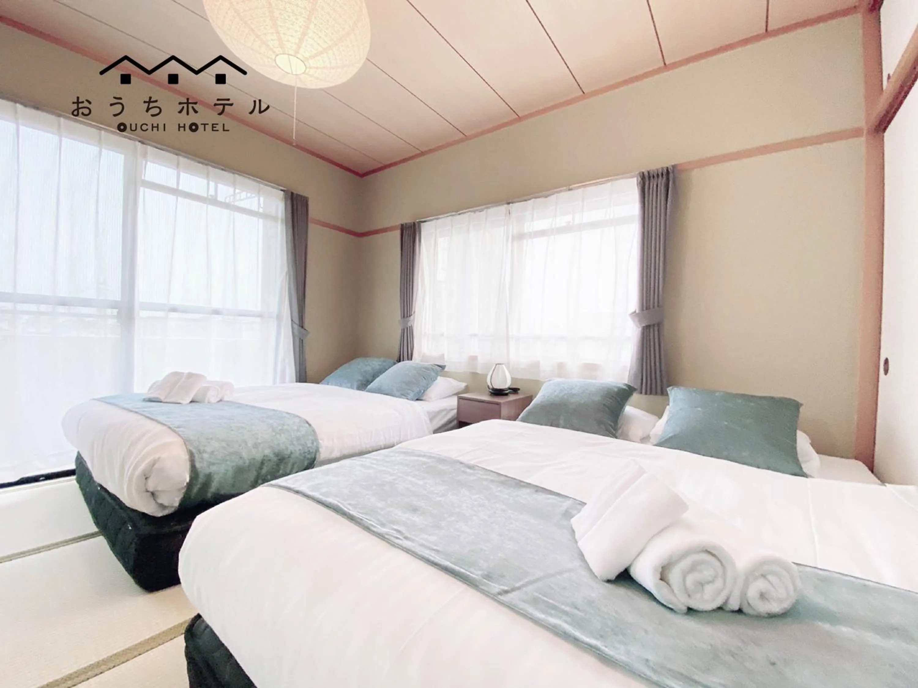 Bed in OUCHI HOTEL Itsukaichi