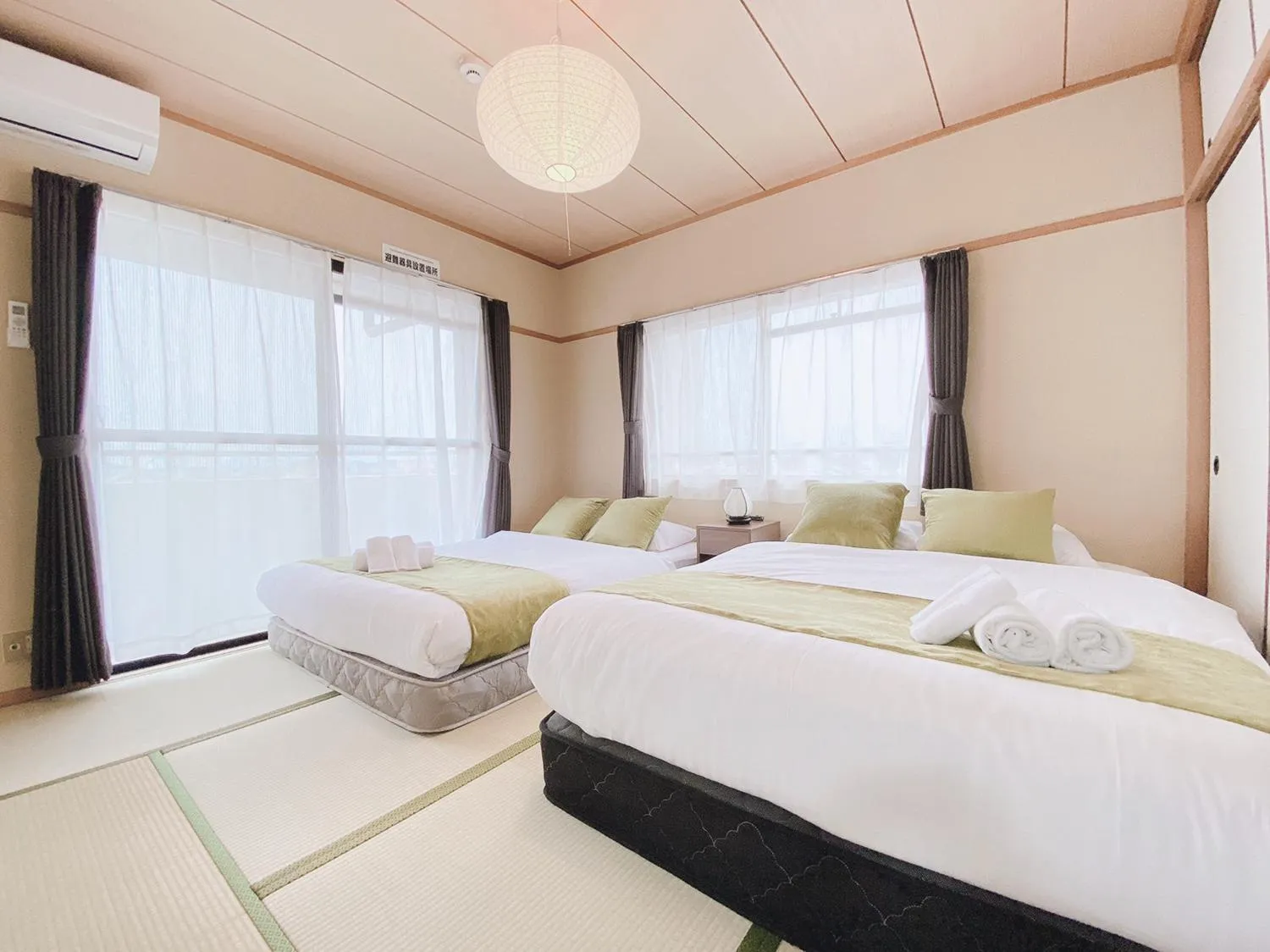 Bed in OUCHI HOTEL Itsukaichi