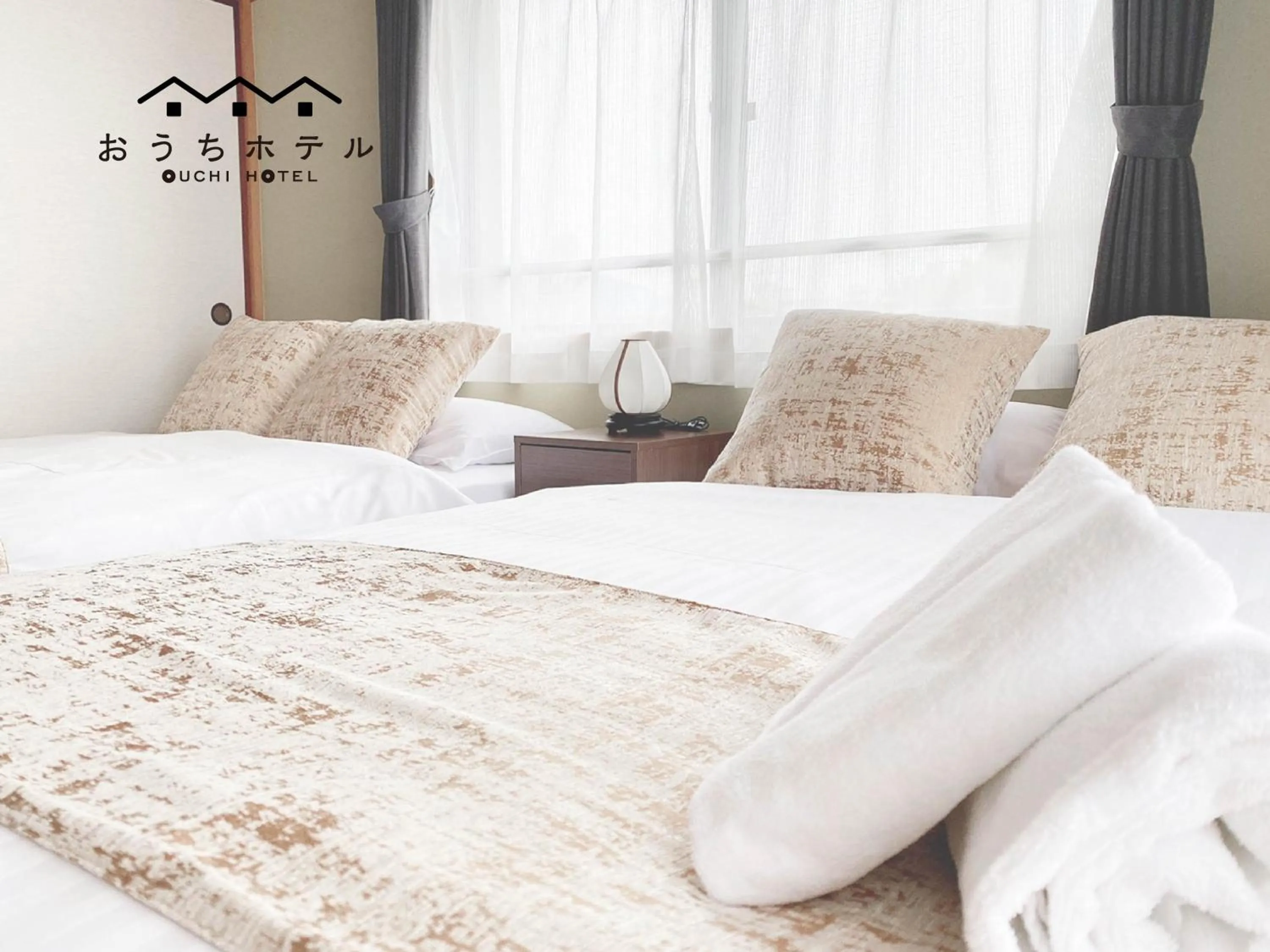 Bed in OUCHI HOTEL Itsukaichi