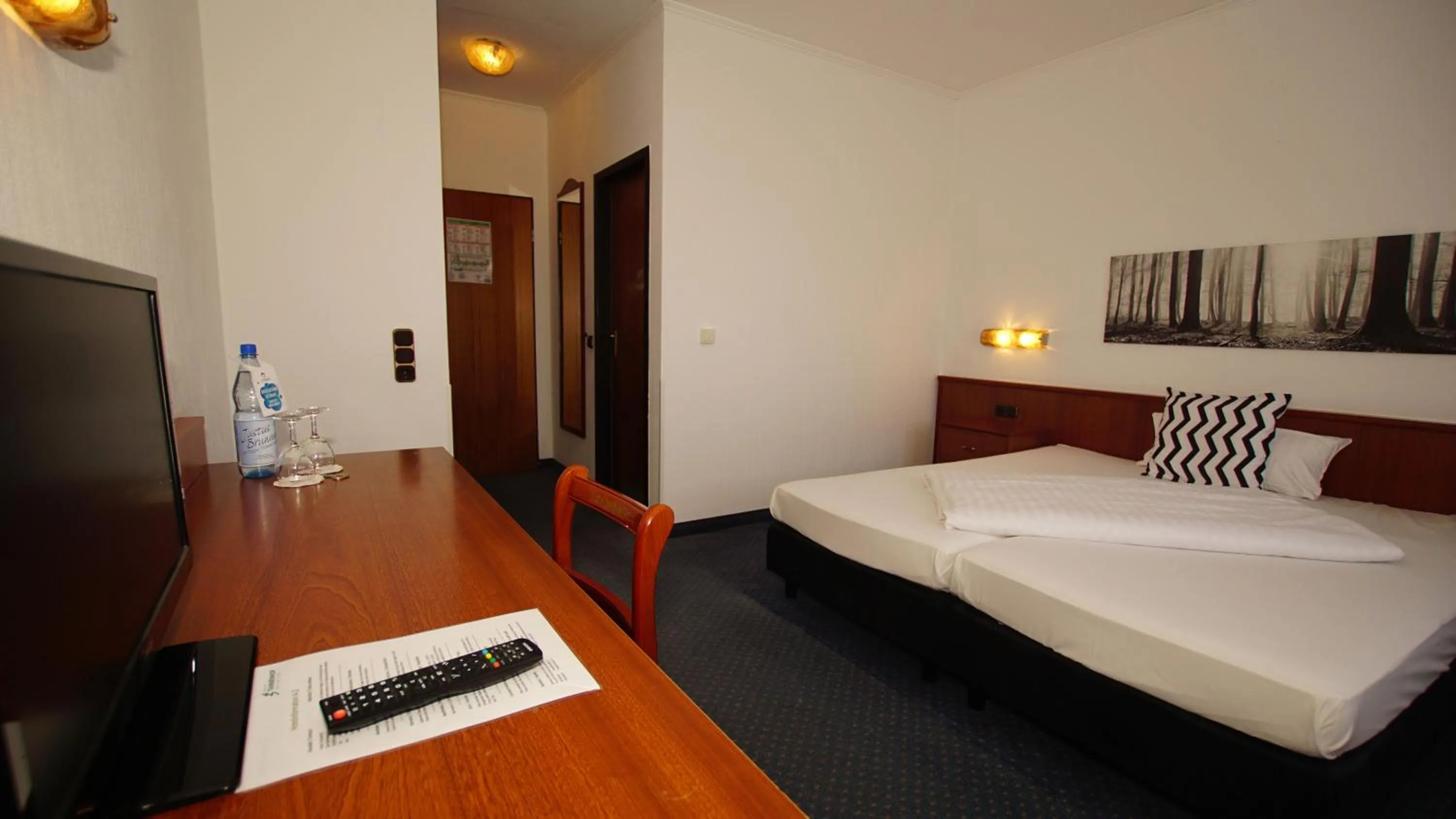 Photo of the whole room, Bed in Hotel Tannenhof Haiger