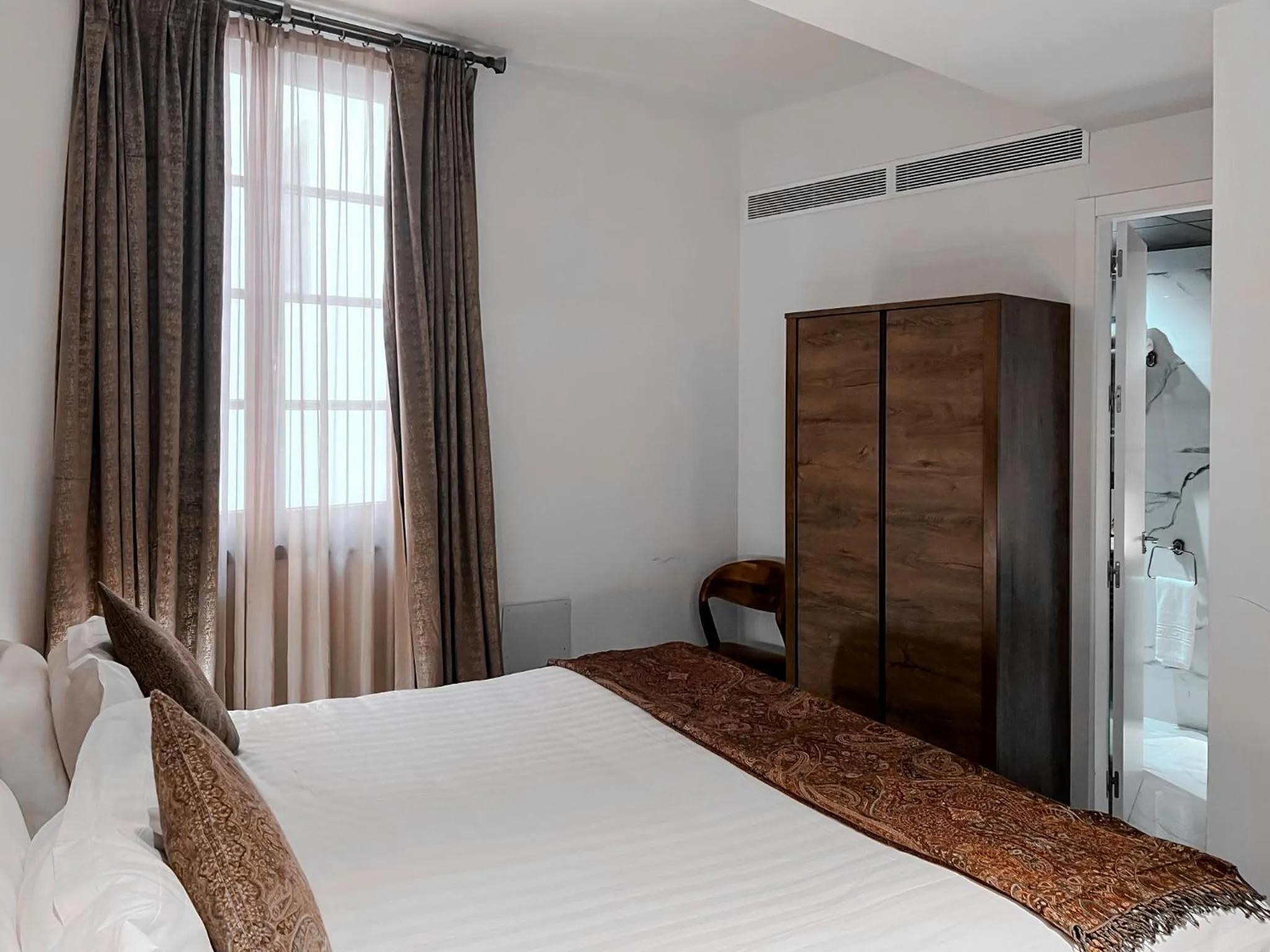 Bed in Anahita Boutique Hotel