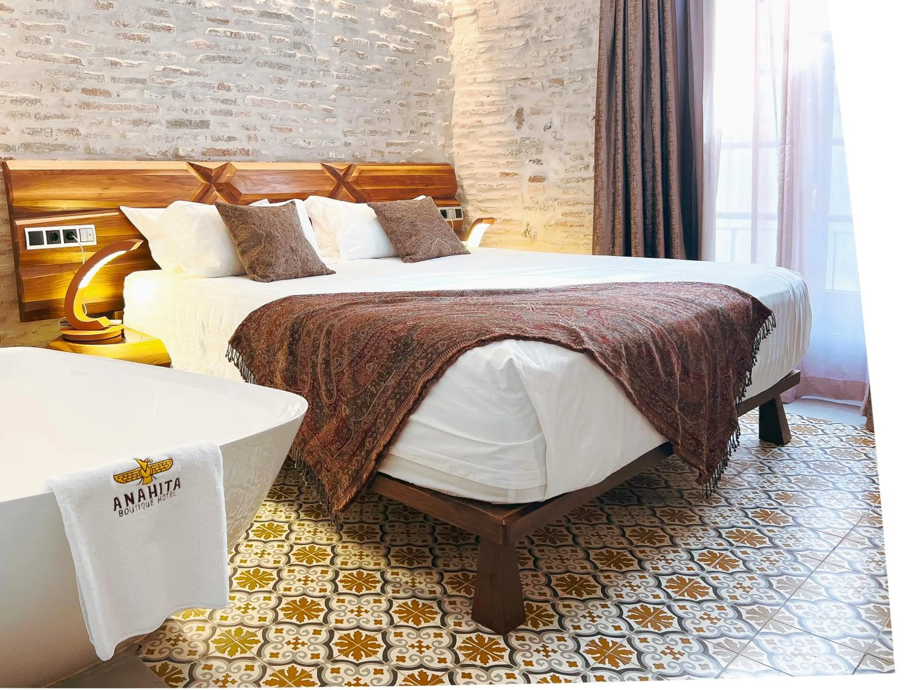 Bed in Anahita Boutique Hotel