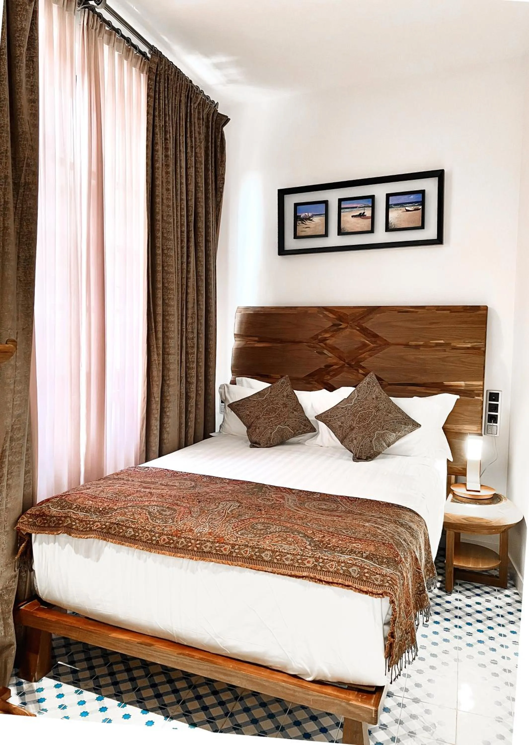 Bed in Anahita Boutique Hotel