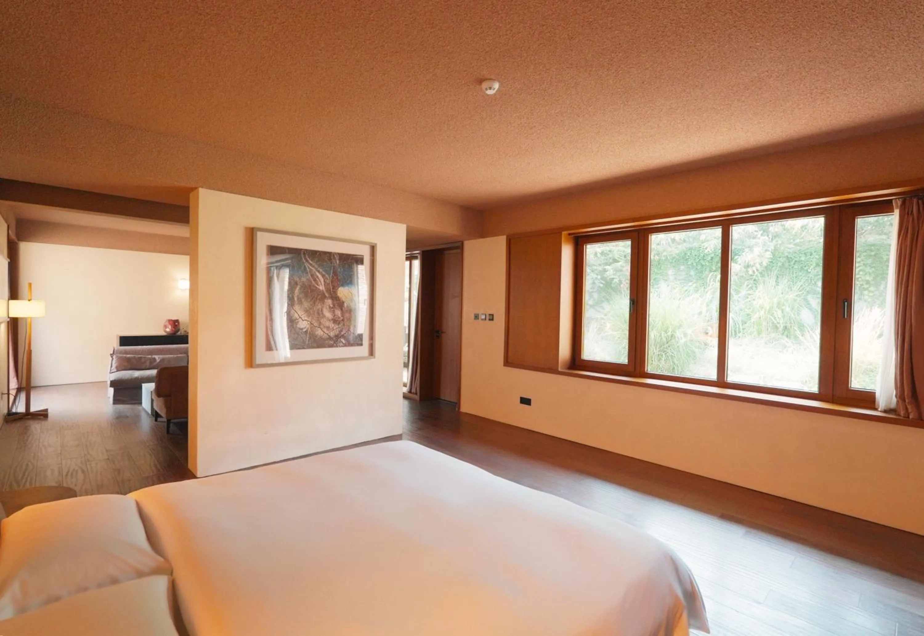 Bed in Sansa Village Boutique Hotel at Mutianyu Great Wall Adjoin to Mutianyu Great Wall - Room with the View of Great Wall - Jacuzzi with the View of Great Wall - Vehicle Shuttle Service - International Catering - SPA& Nail Beauty Facilities