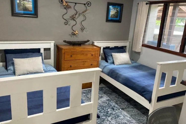 Bed in Vanuatu Beachfront Apartments