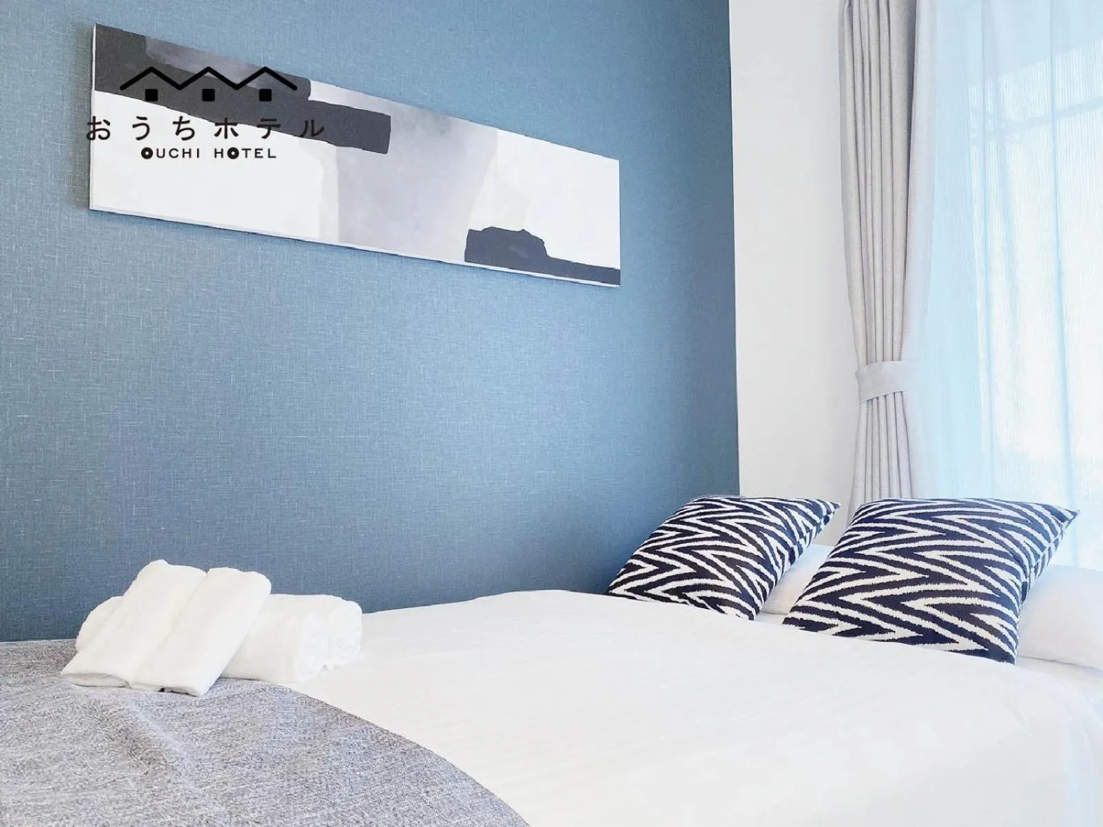 Bed in OUCHI HOTEL Hatsukaichi-Ekimae