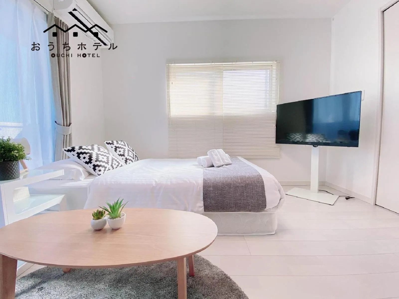 Bed in OUCHI HOTEL Hatsukaichi-Ekimae