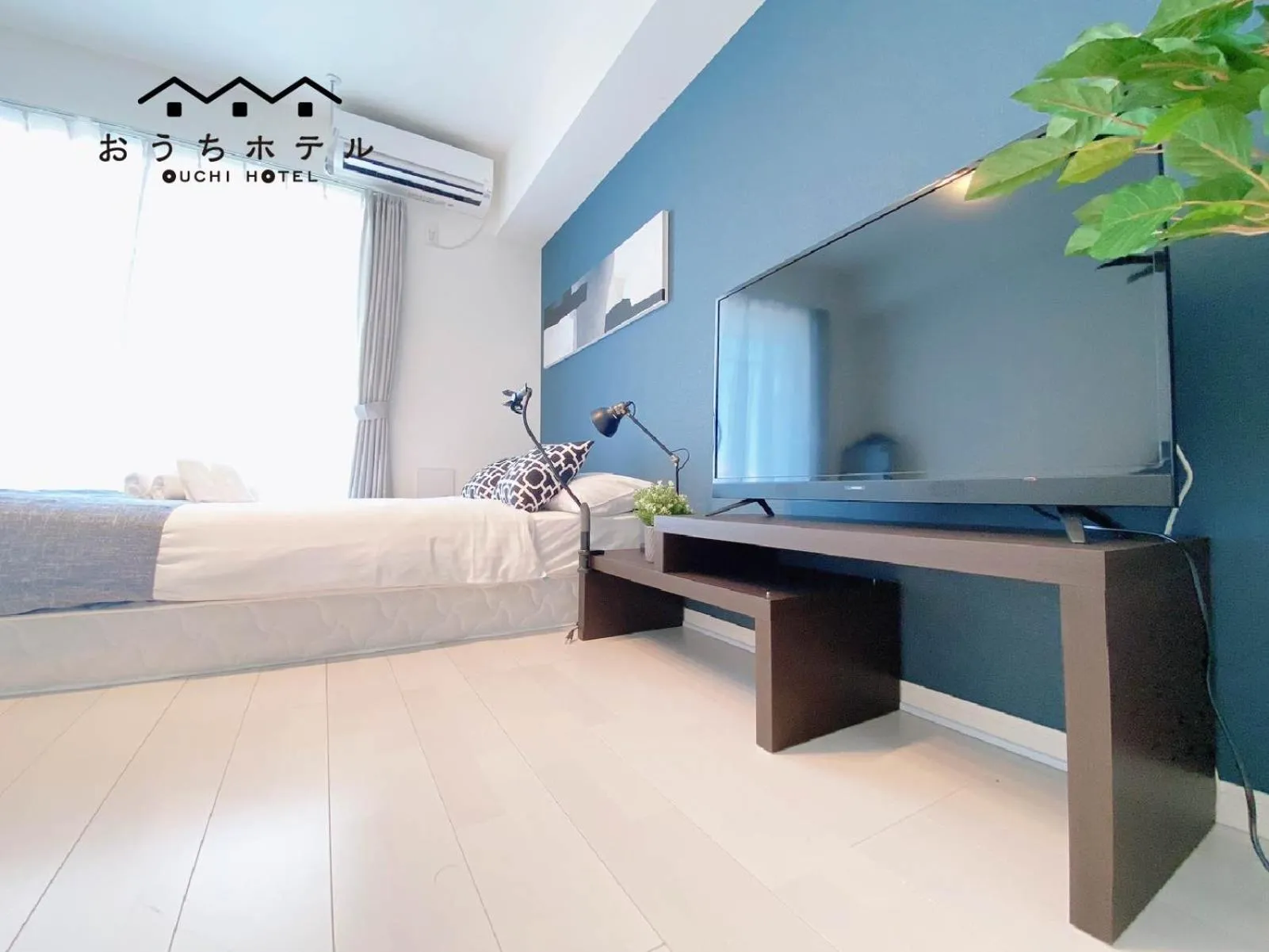 Bed in OUCHI HOTEL Hatsukaichi-Ekimae