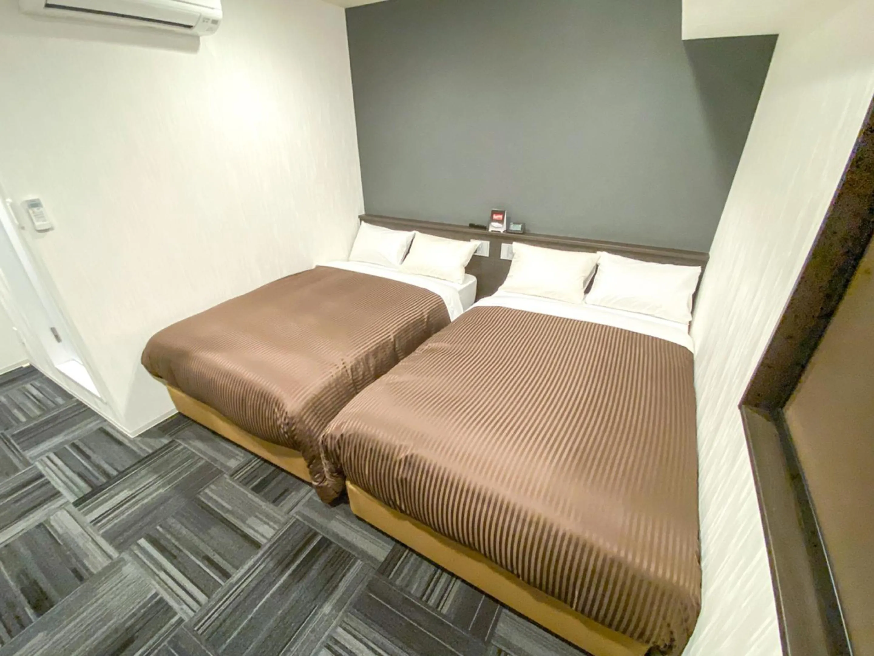 Bed in HOTEL LiVEMAX Okayama Kurashiki Ekimae