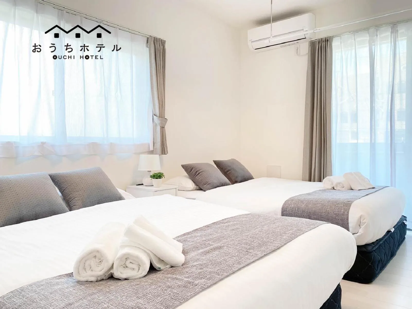 Bed in OUCHI HOTEL Miyajimaguchi