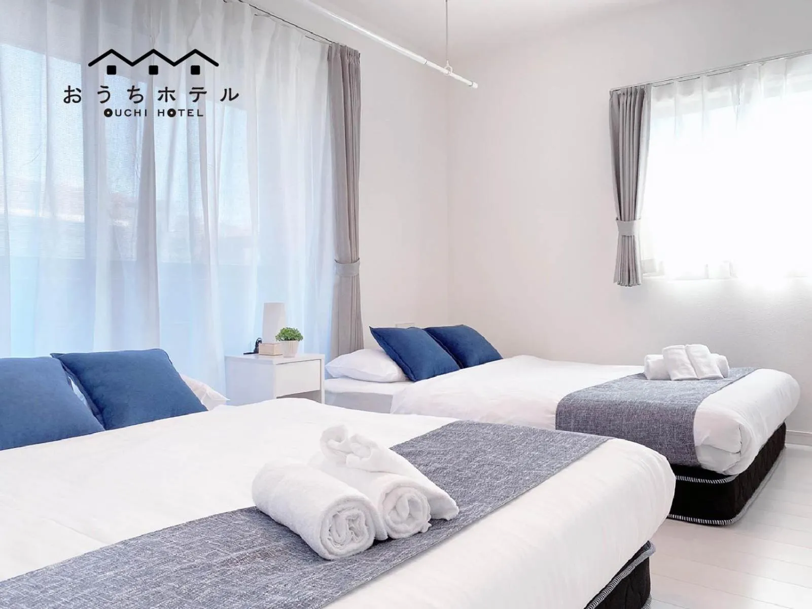 Bed in OUCHI HOTEL Miyajimaguchi