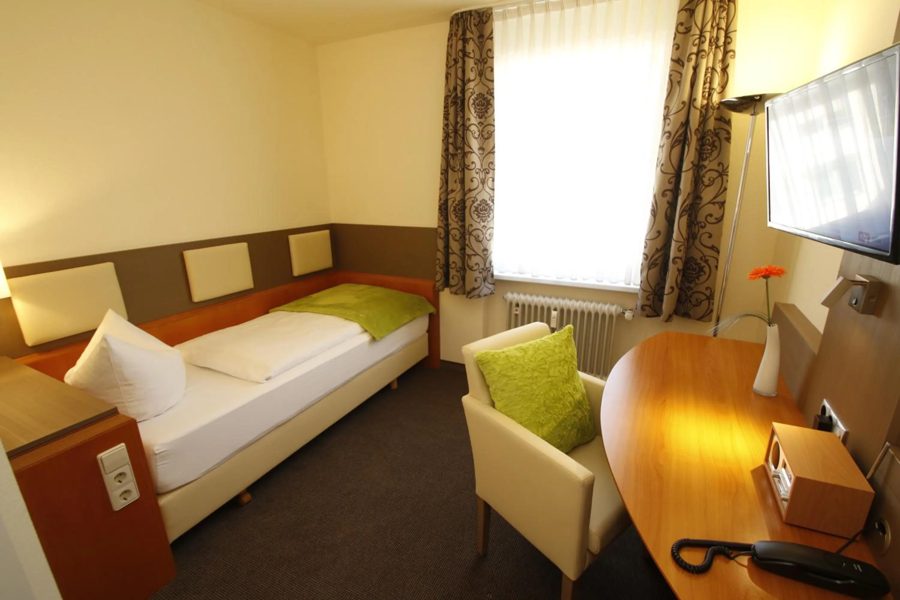 Photo of the whole room, Bed in City Hotel Freiburg