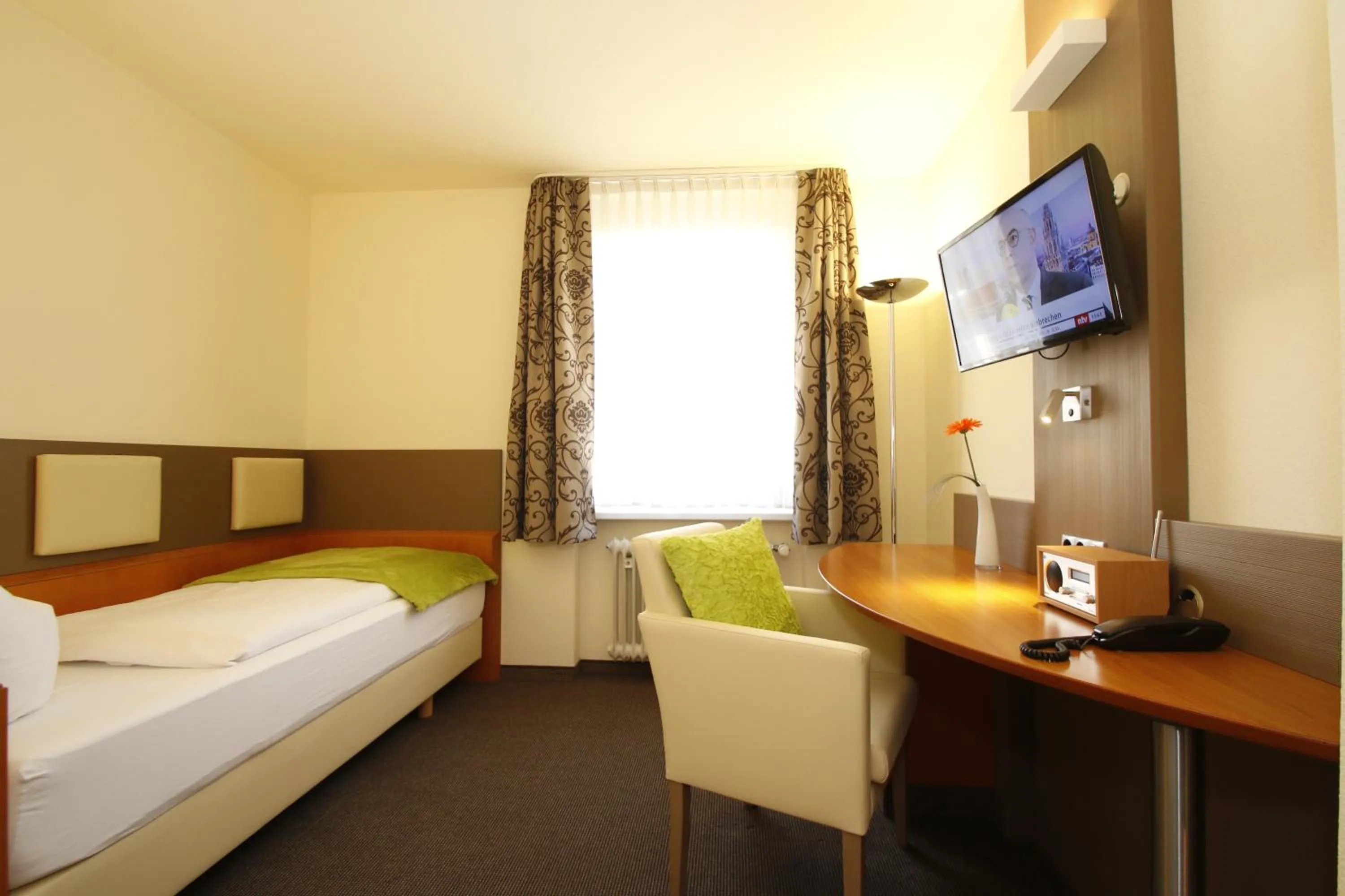 Photo of the whole room, Bed in City Hotel Freiburg