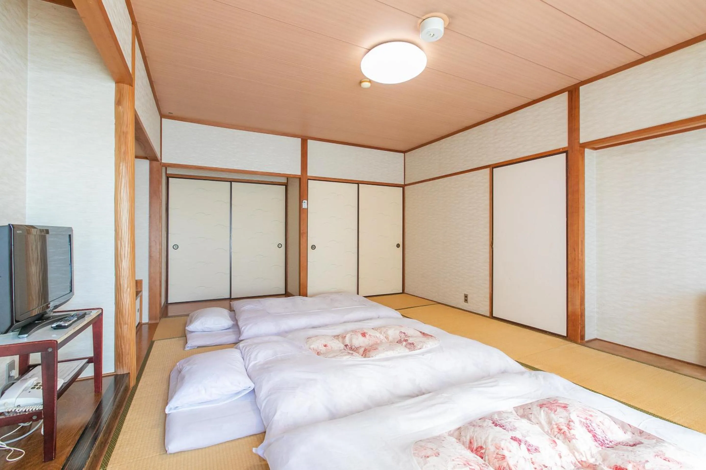 Photo of the whole room, Bed in Tabist Setouchinoyado Takehara Seaside