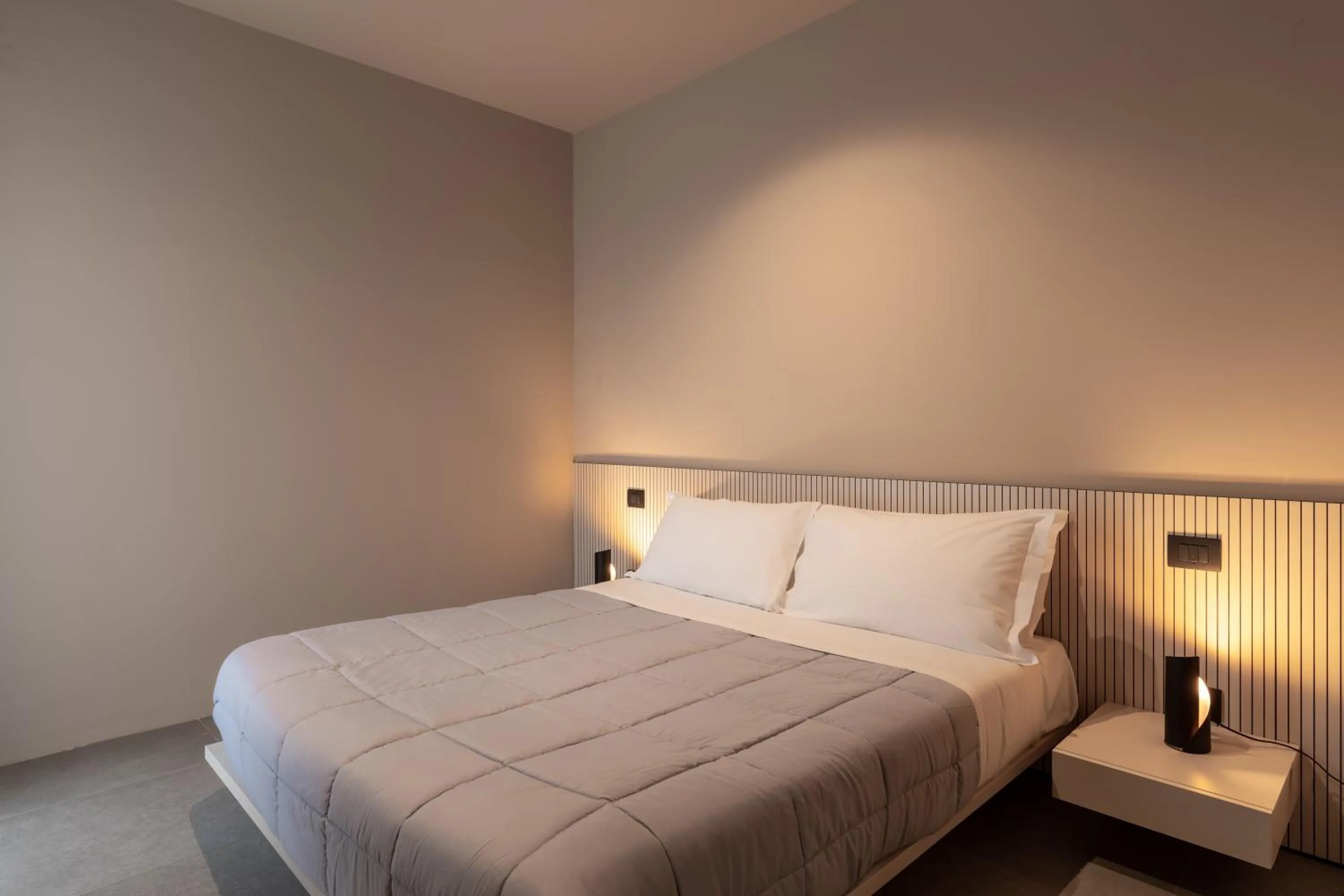 Bed in Amare Suite & Apartments