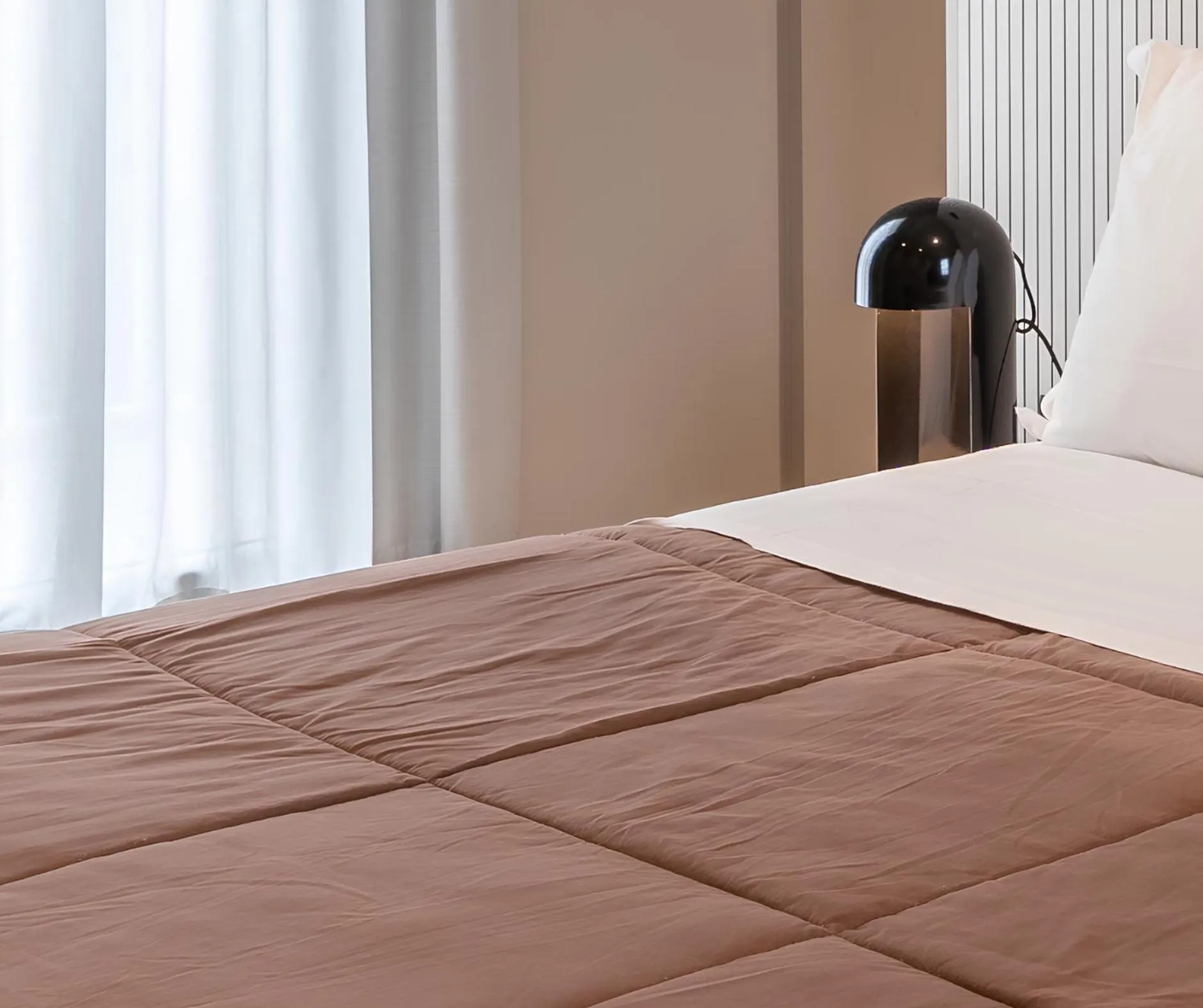 Bed in Amare Suite & Apartments