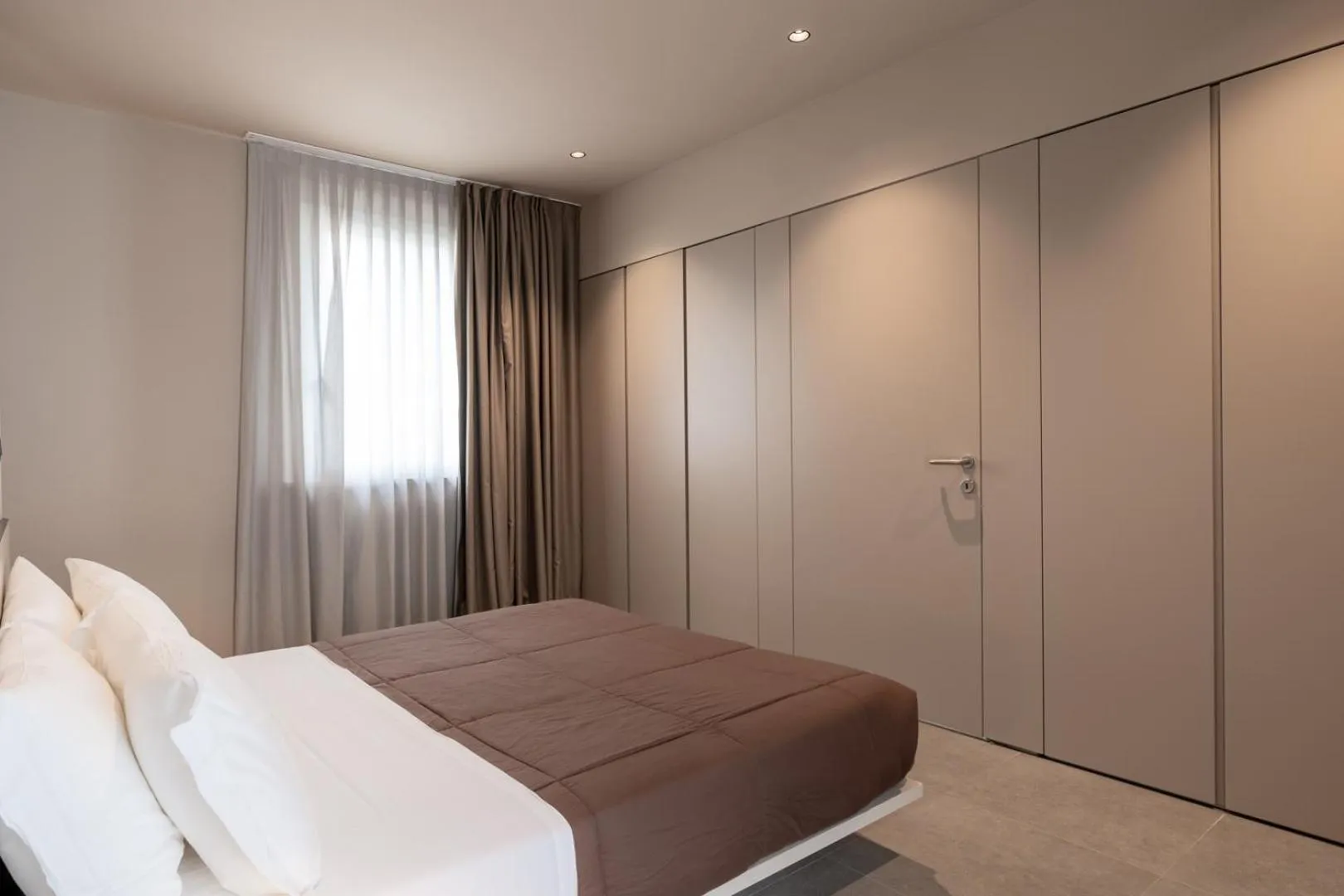 Bed in Amare Suite & Apartments