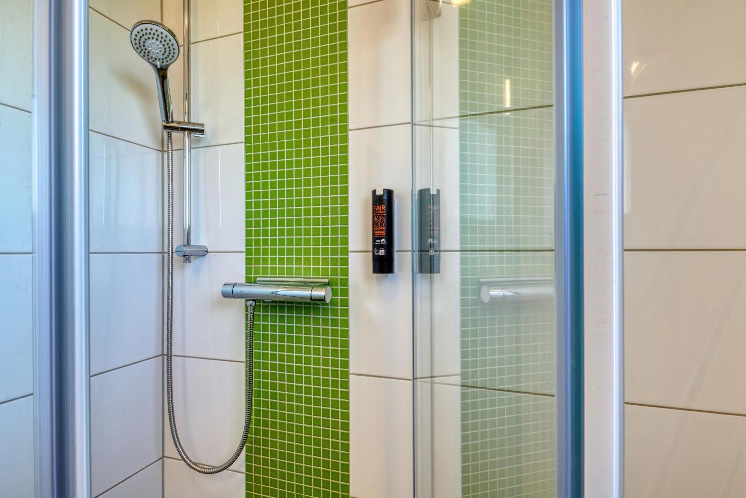 Shower in NiceToStay by Fairway Hotels