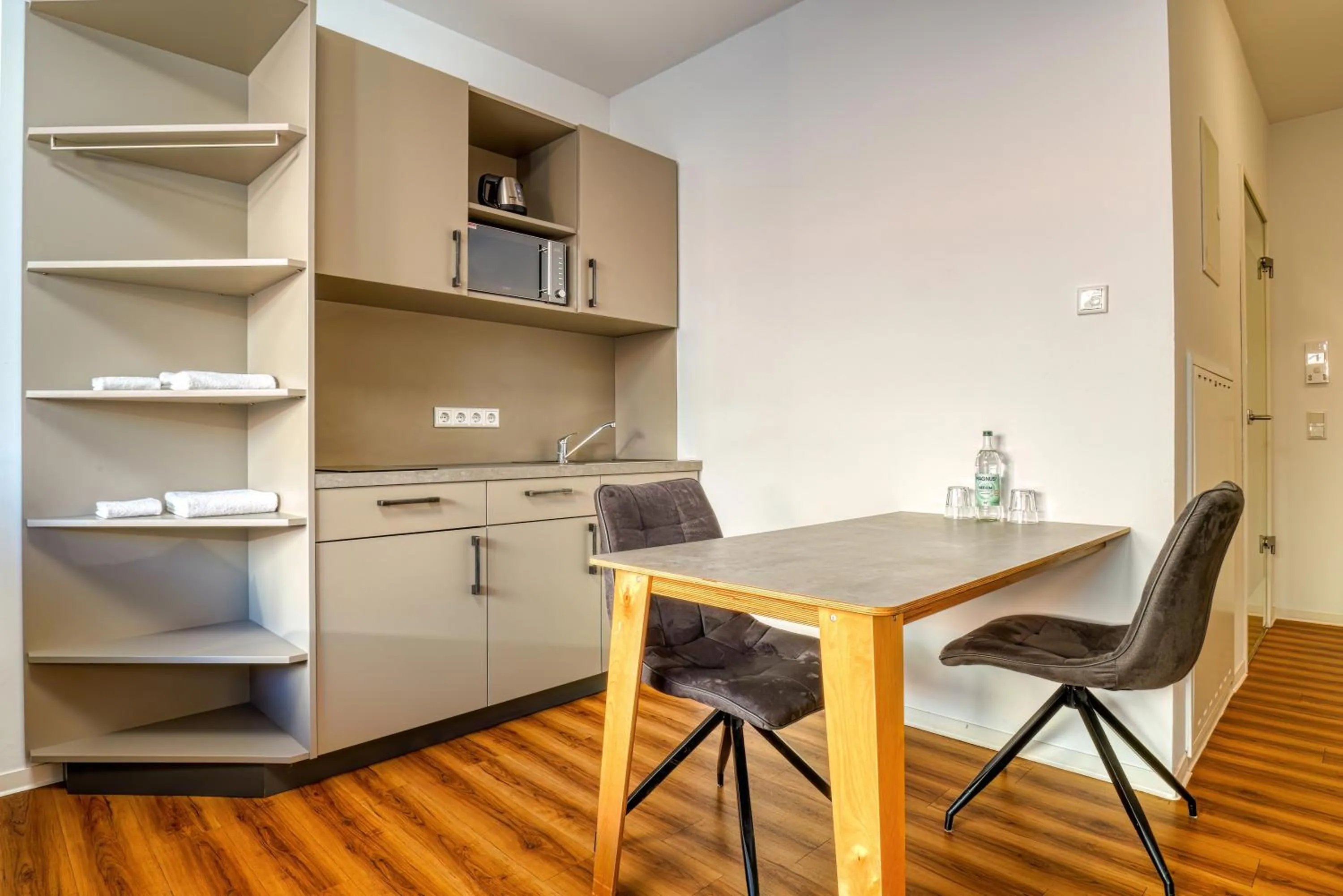 Kitchen or kitchenette in NiceToStay by Fairway Hotels