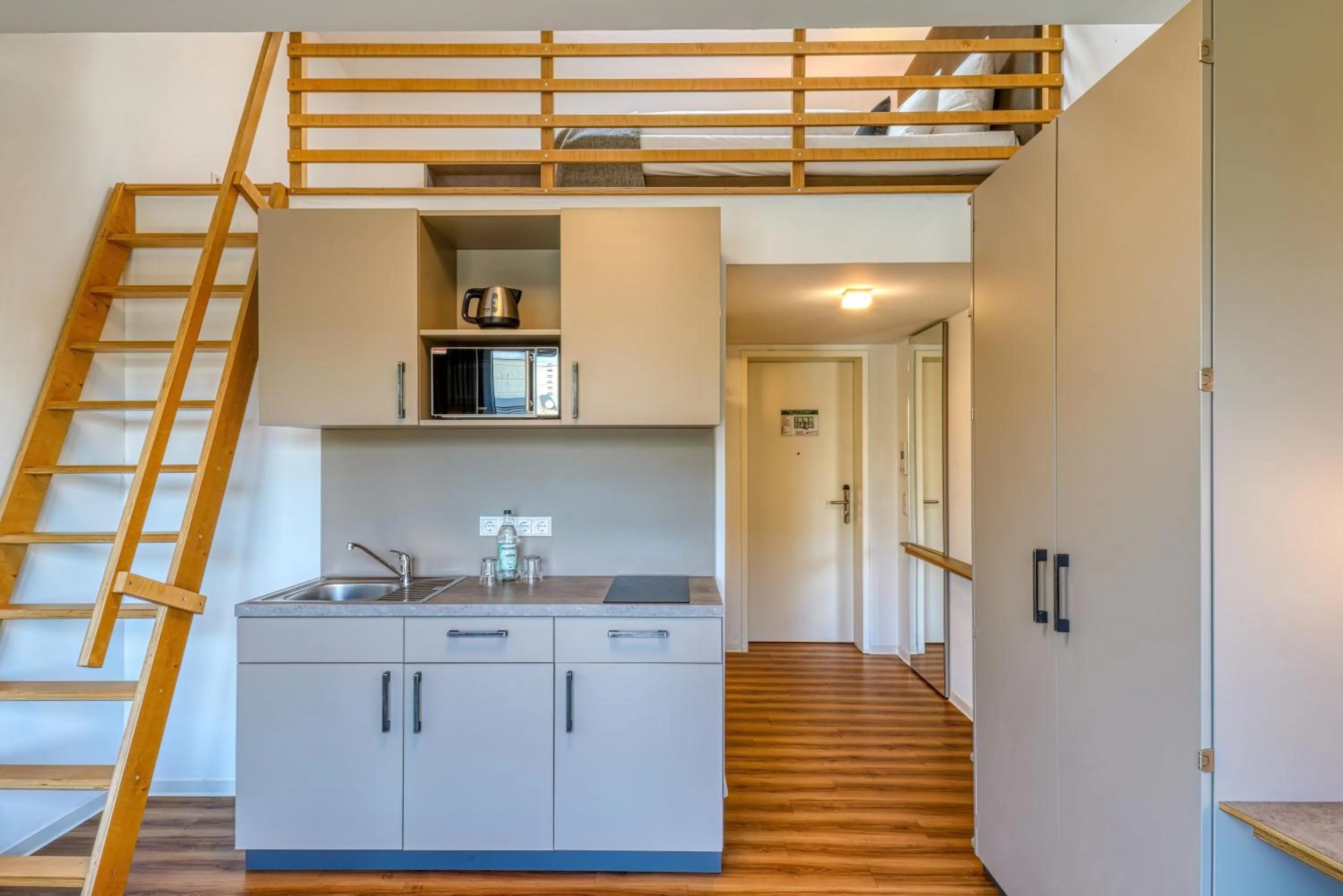 Kitchen or kitchenette in NiceToStay by Fairway Hotels