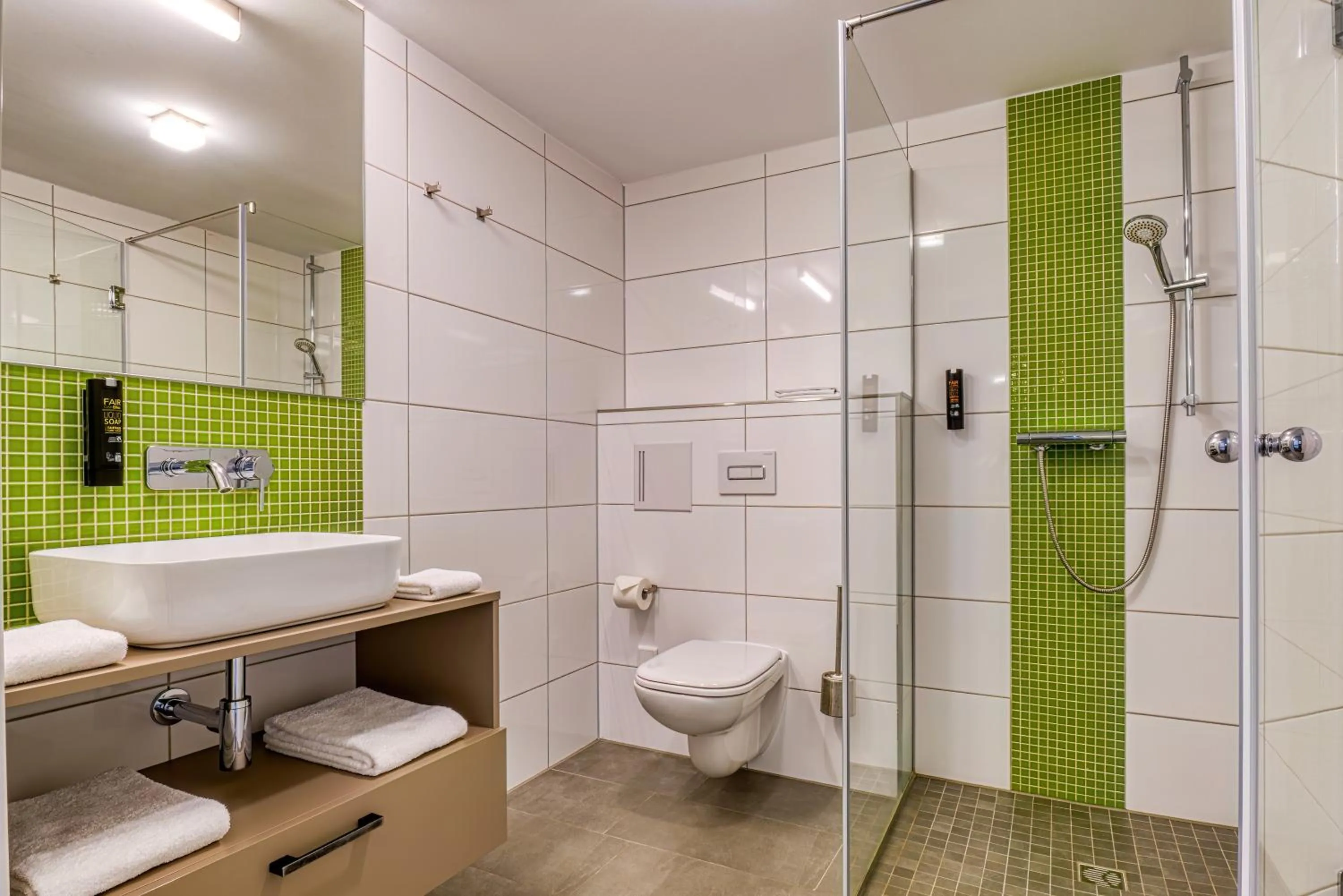 Shower in NiceToStay by Fairway Hotels