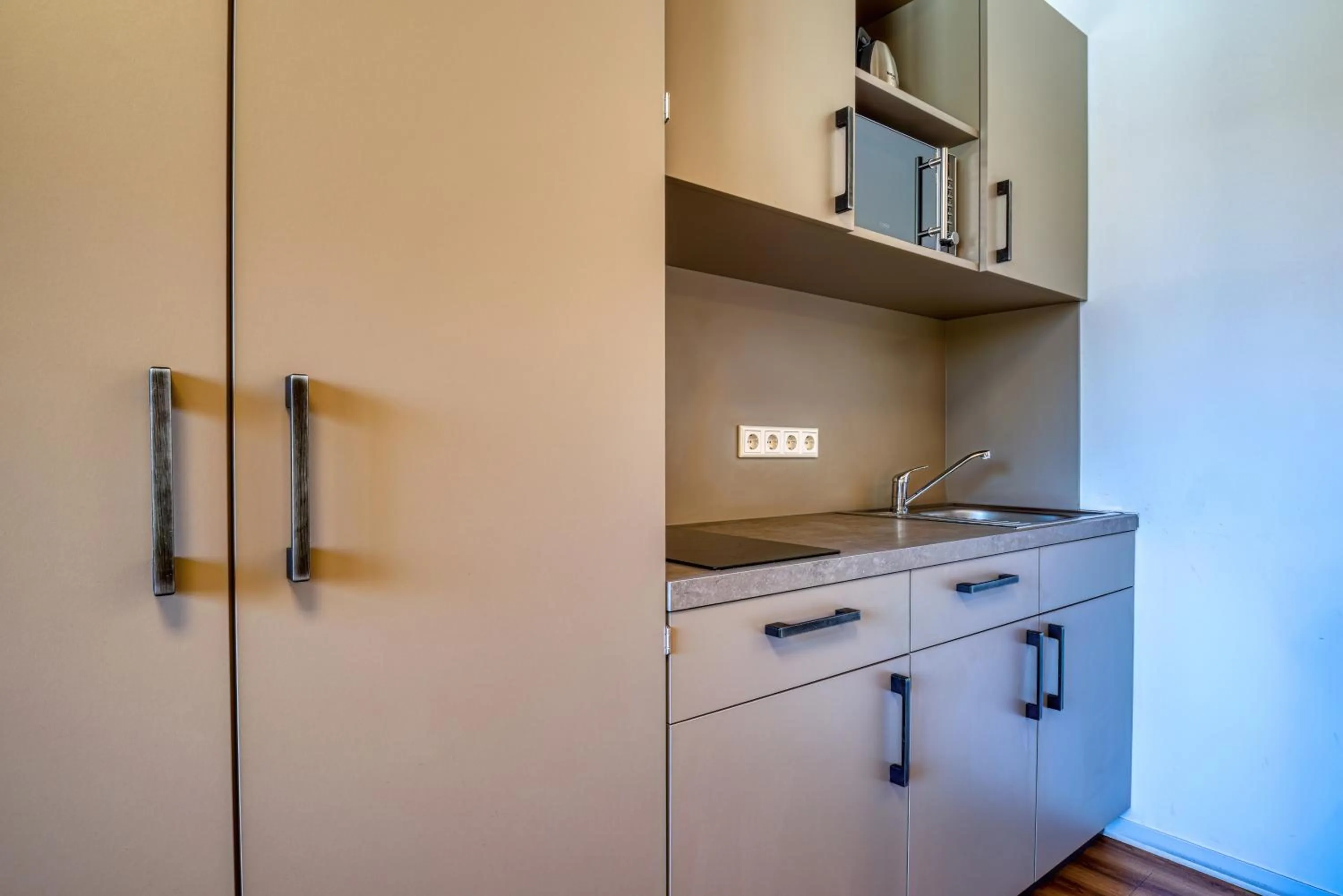 stove in NiceToStay by Fairway Hotels