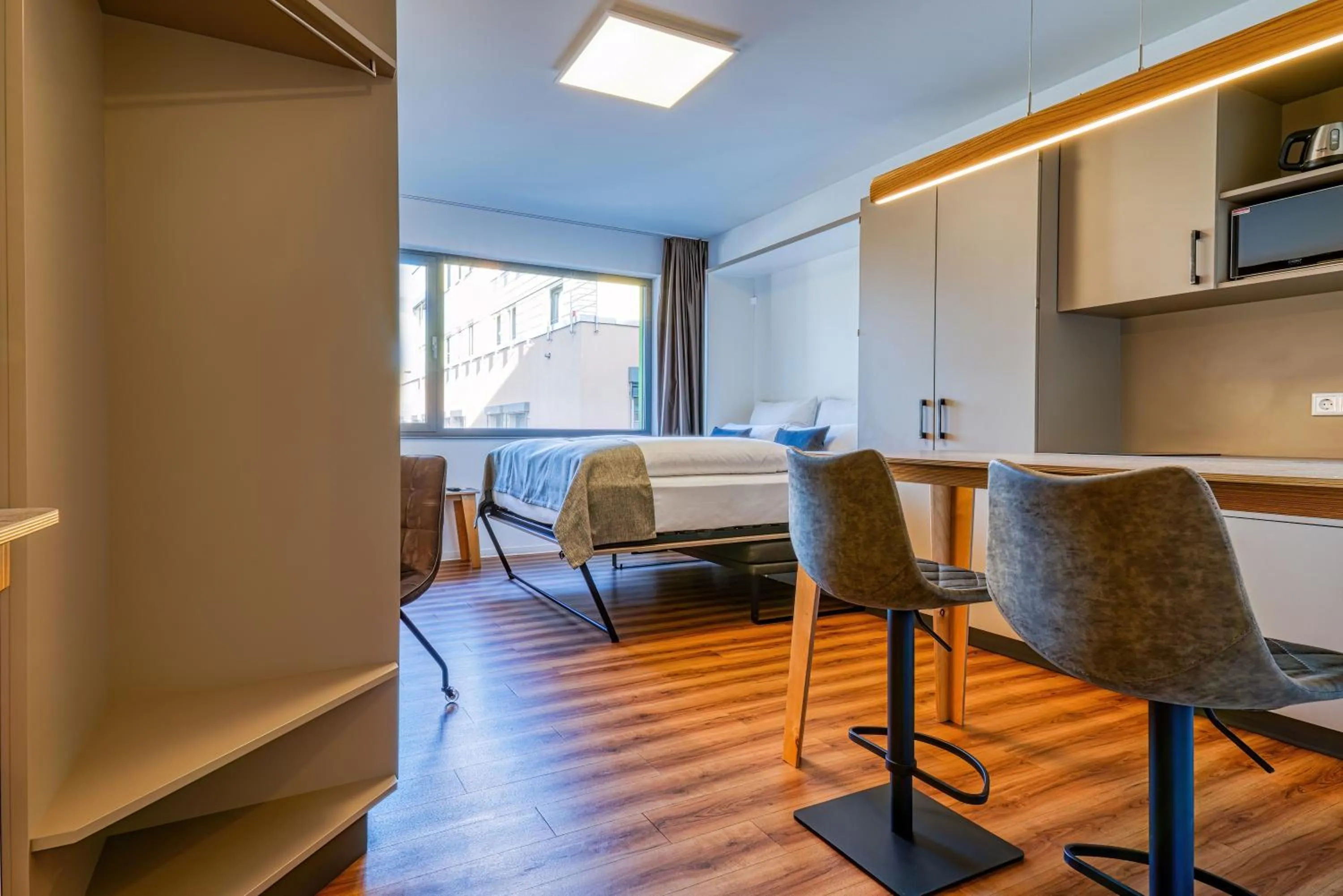 Seating area in NiceToStay by Fairway Hotels