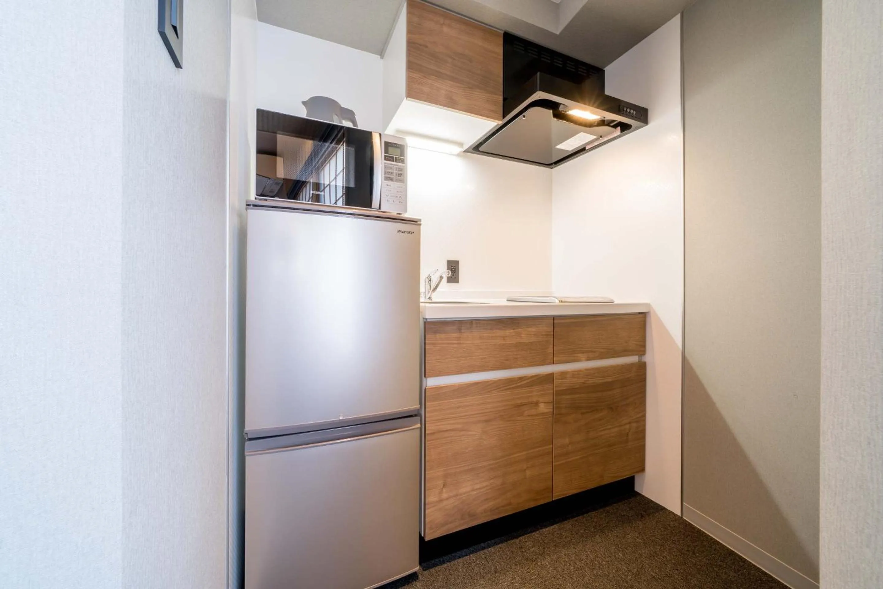 Kitchen or kitchenette in RESI STAY Hotel Sun Chlorella