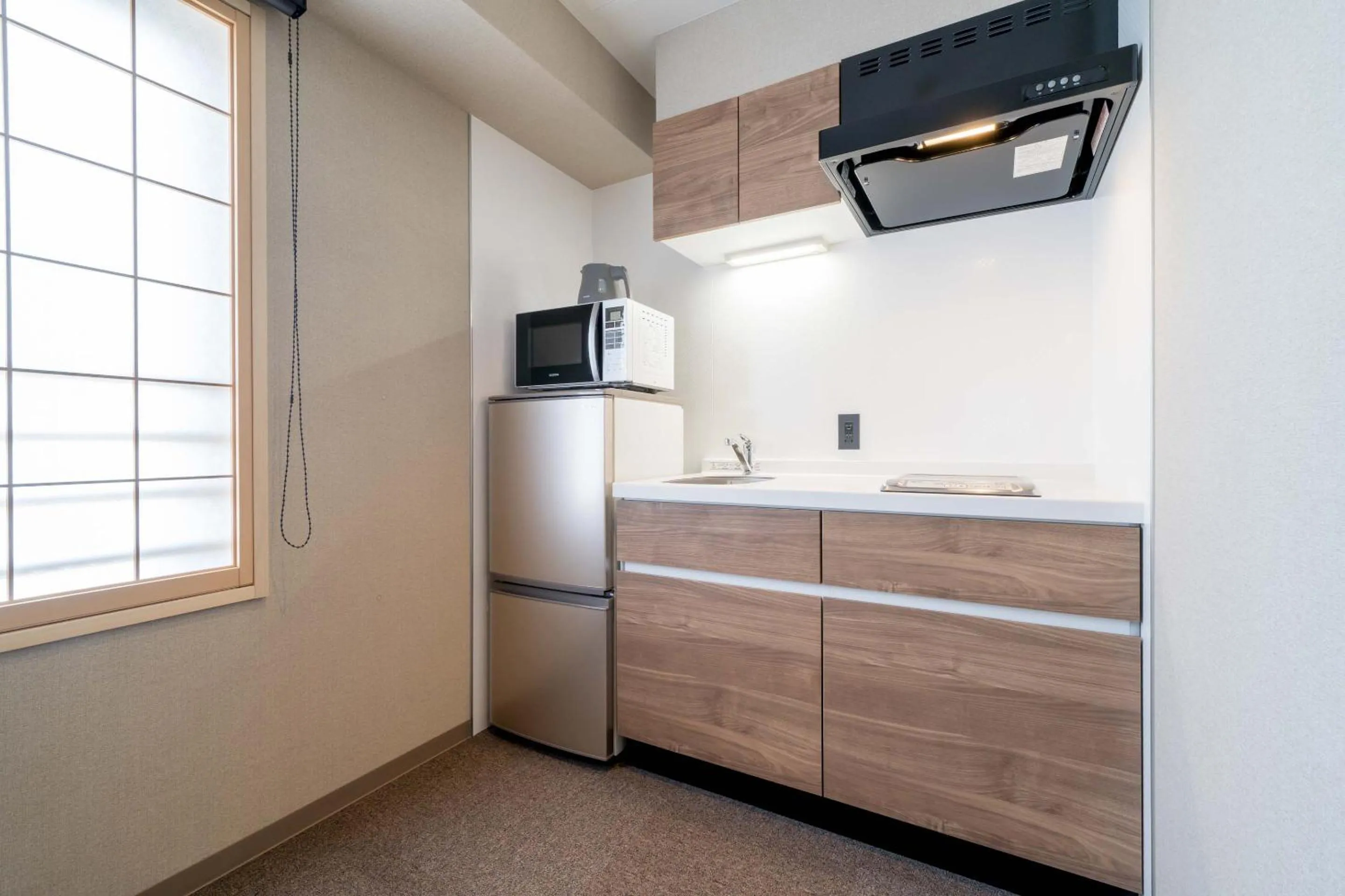 Kitchen or kitchenette in RESI STAY Hotel Sun Chlorella