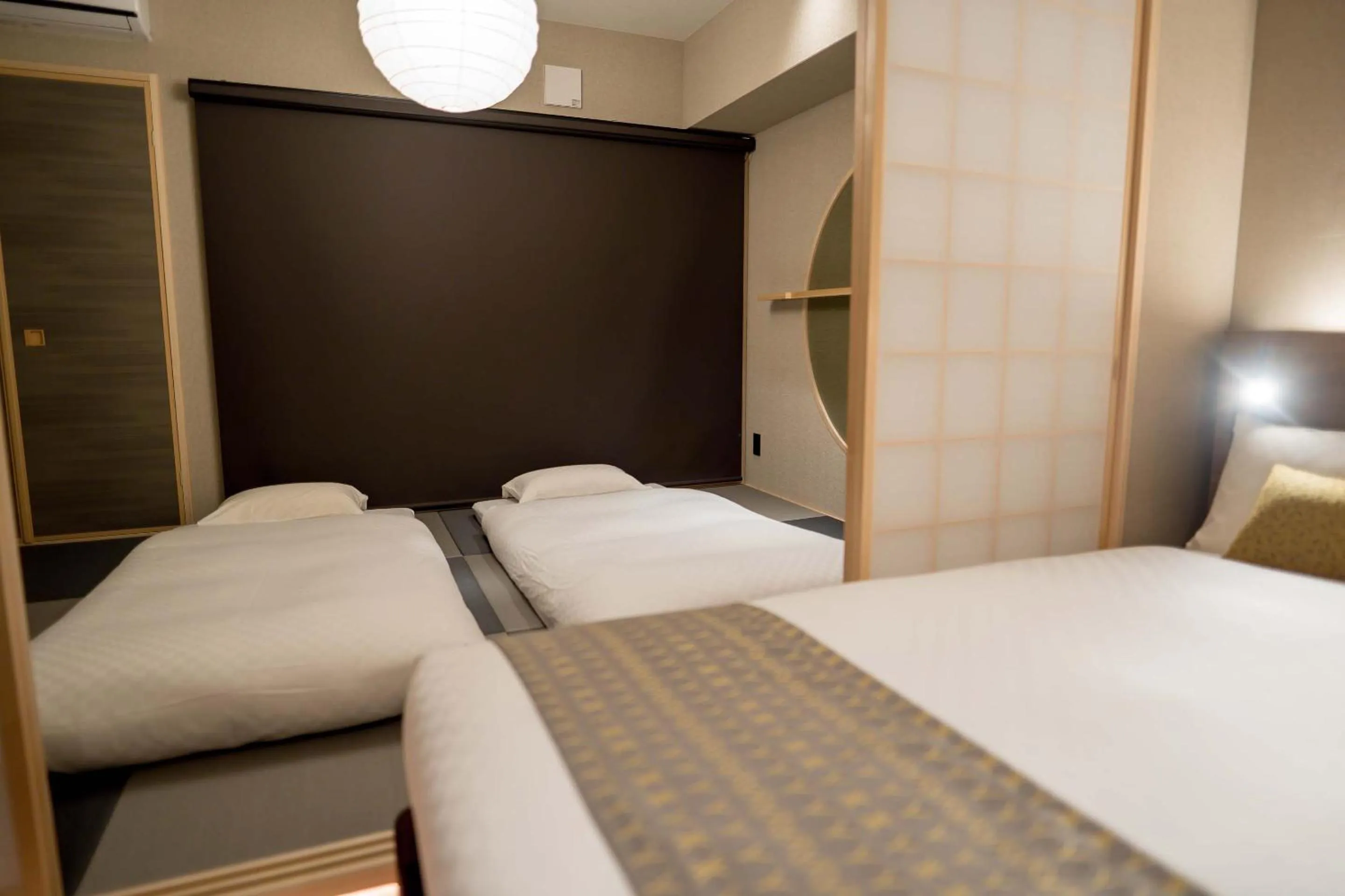 Bed in RESI STAY Hotel Sun Chlorella