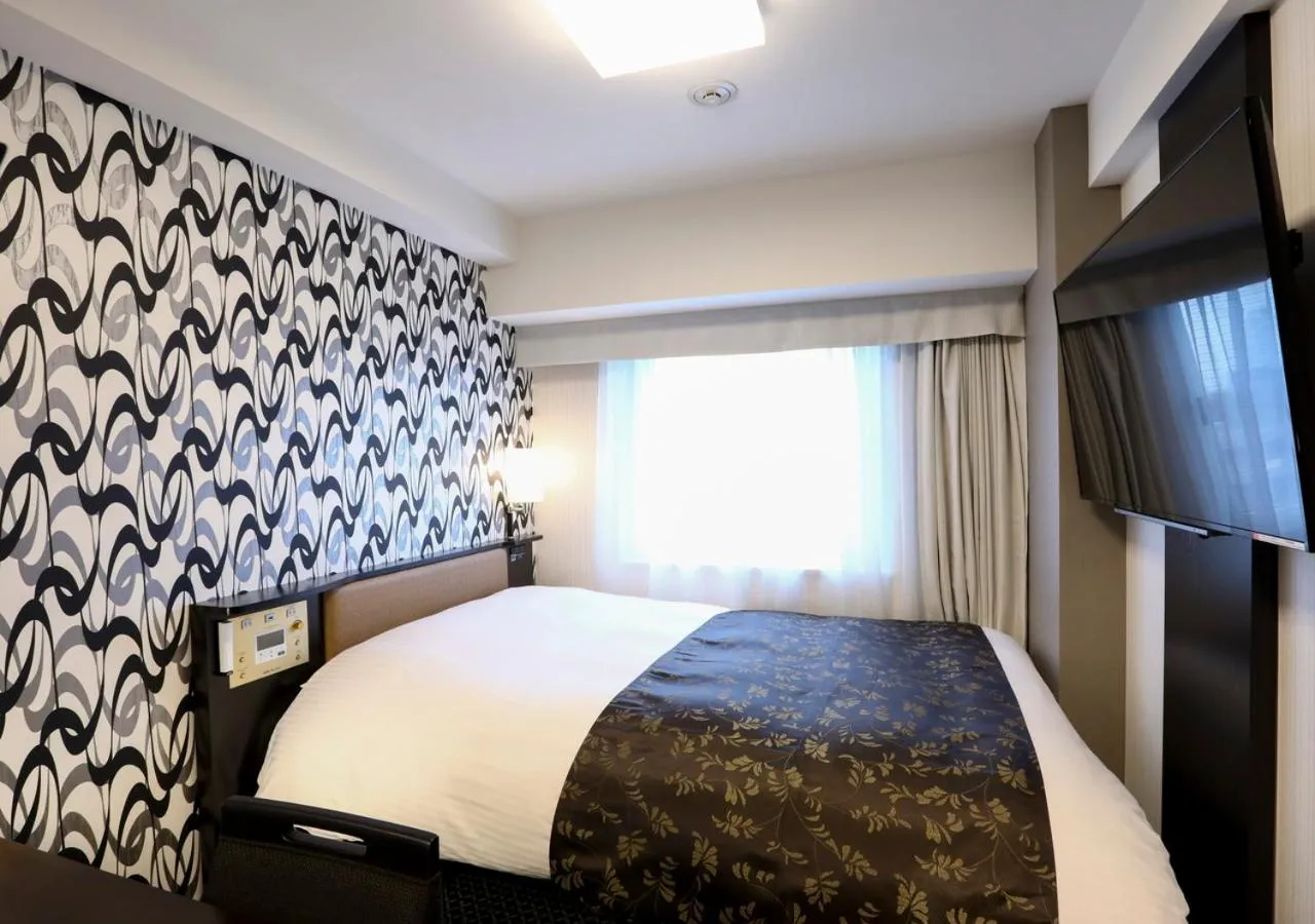 Photo of the whole room, Bed in APA Hotel Higashi Shinjuku Kabukicho Tower