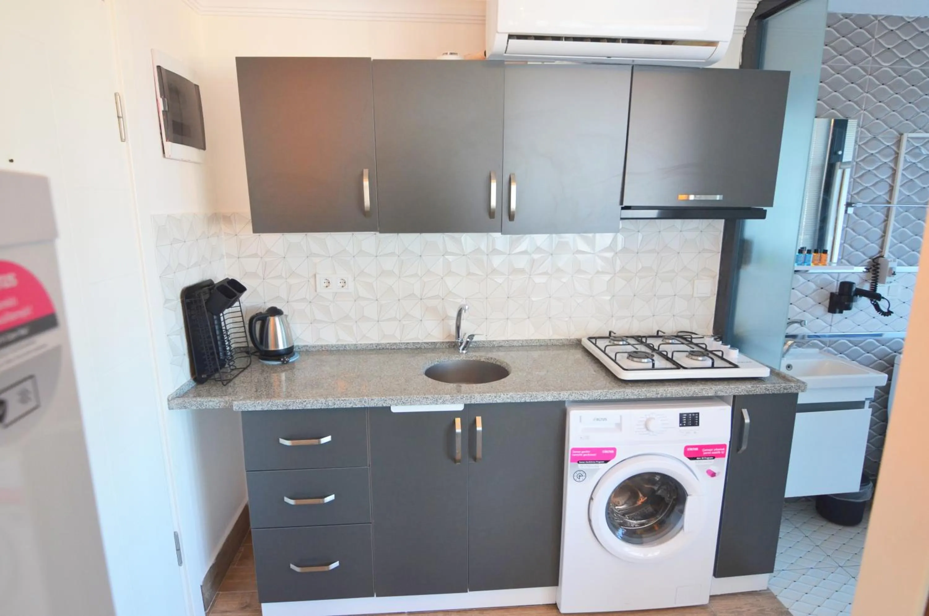 Kitchen or kitchenette in Mykonut Apart Hotel